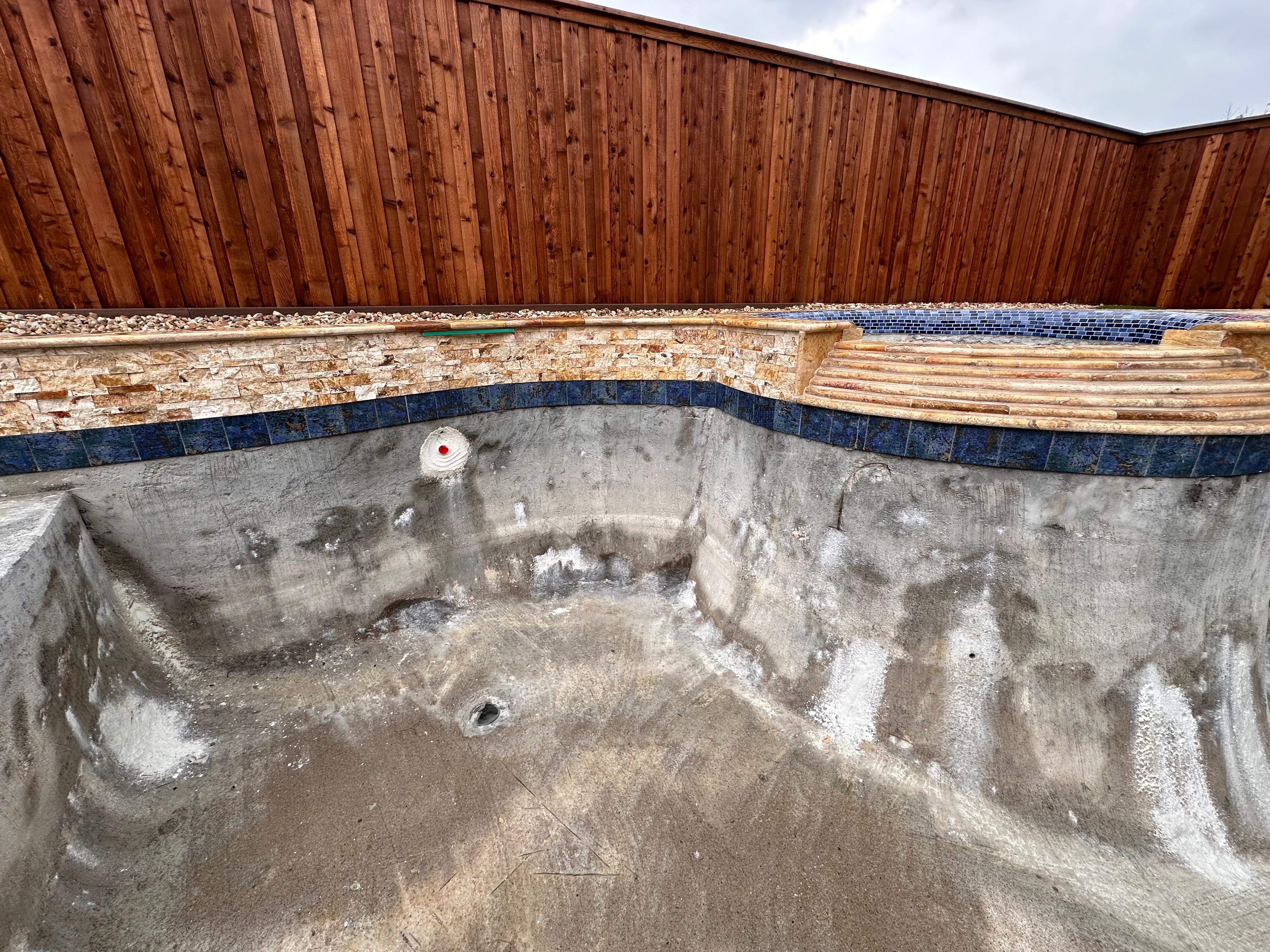 Freeform Pool with Raised Stone Spa by Pinnacle Pools and Spas - DFW