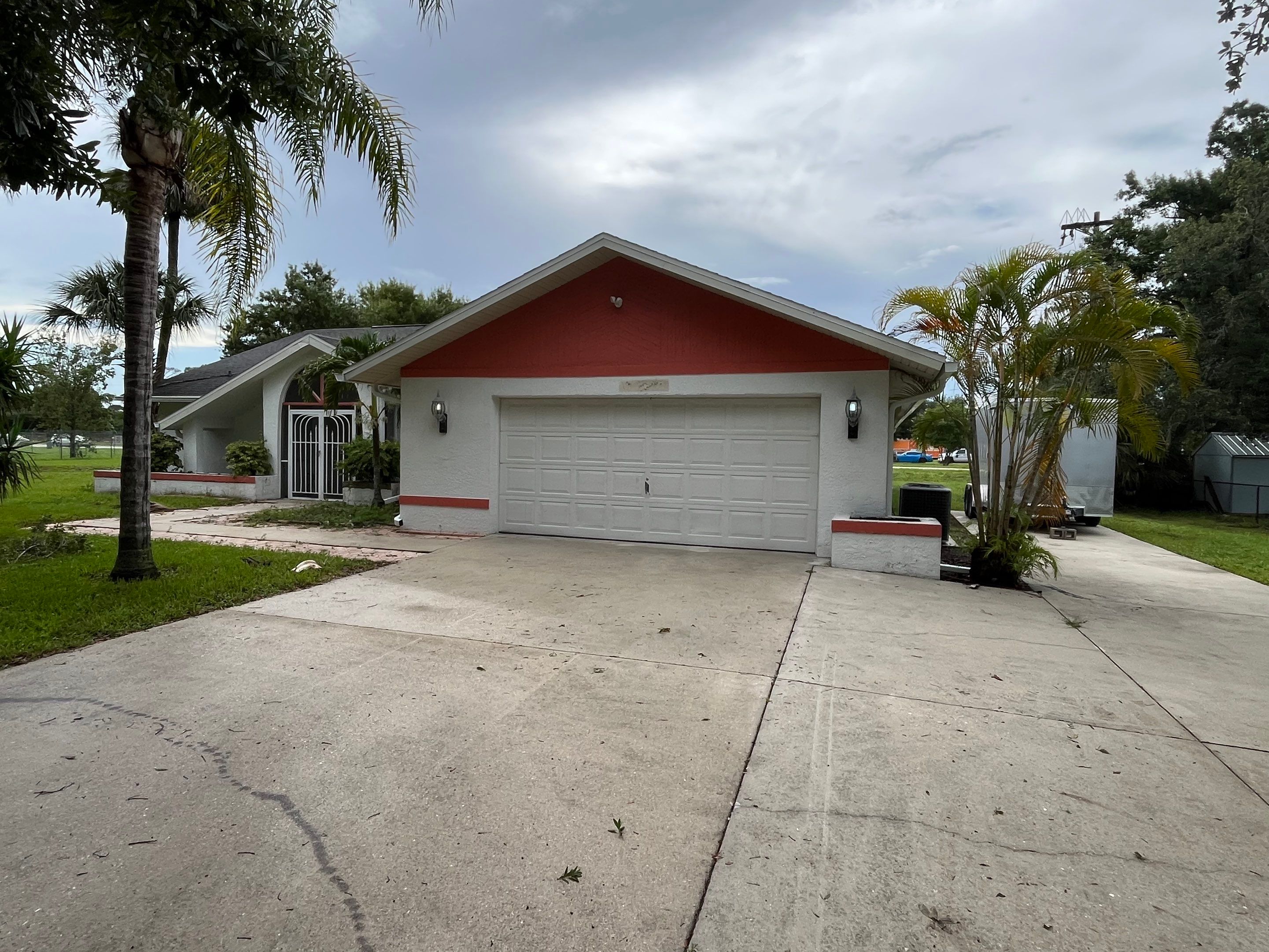 White Seamless Gutters with Splash Guards in North Fort Myers FL by Gutter Professor   by Gutter Professors