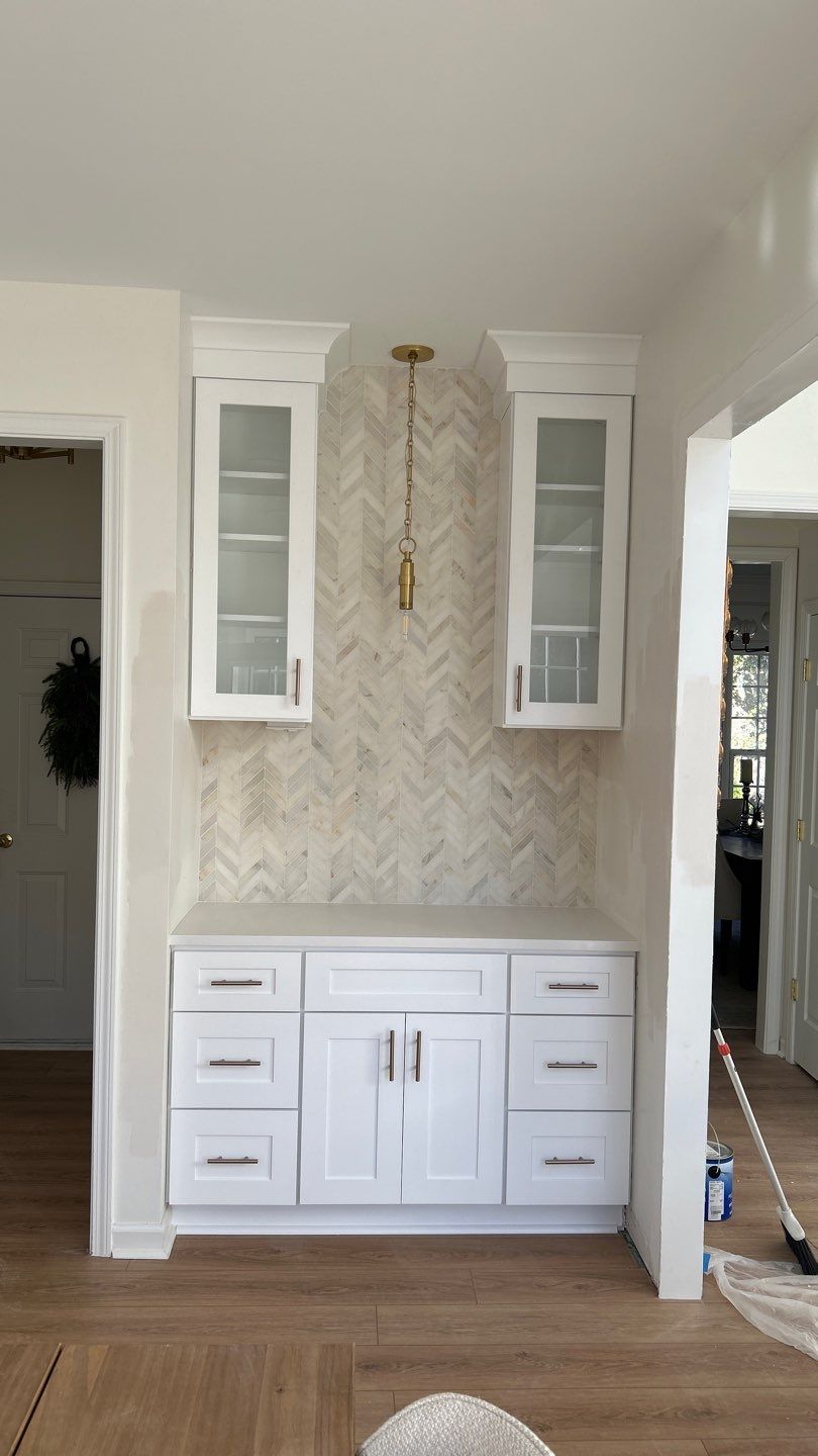 Lovely neutral backsplash  by Footprints Floors of Nashville