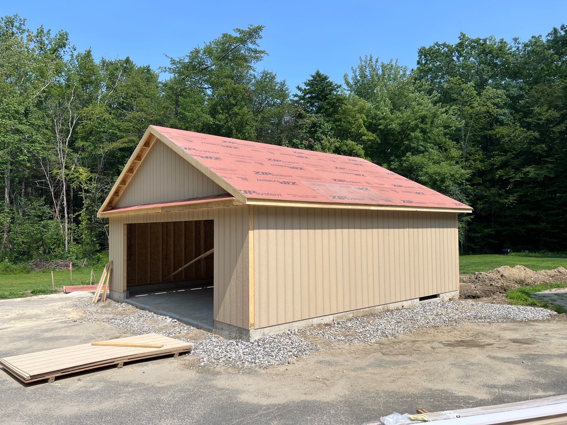 Two-Car Garage using LP SmartSide Panel Siding by Chagnon Building & Remodeling LLC