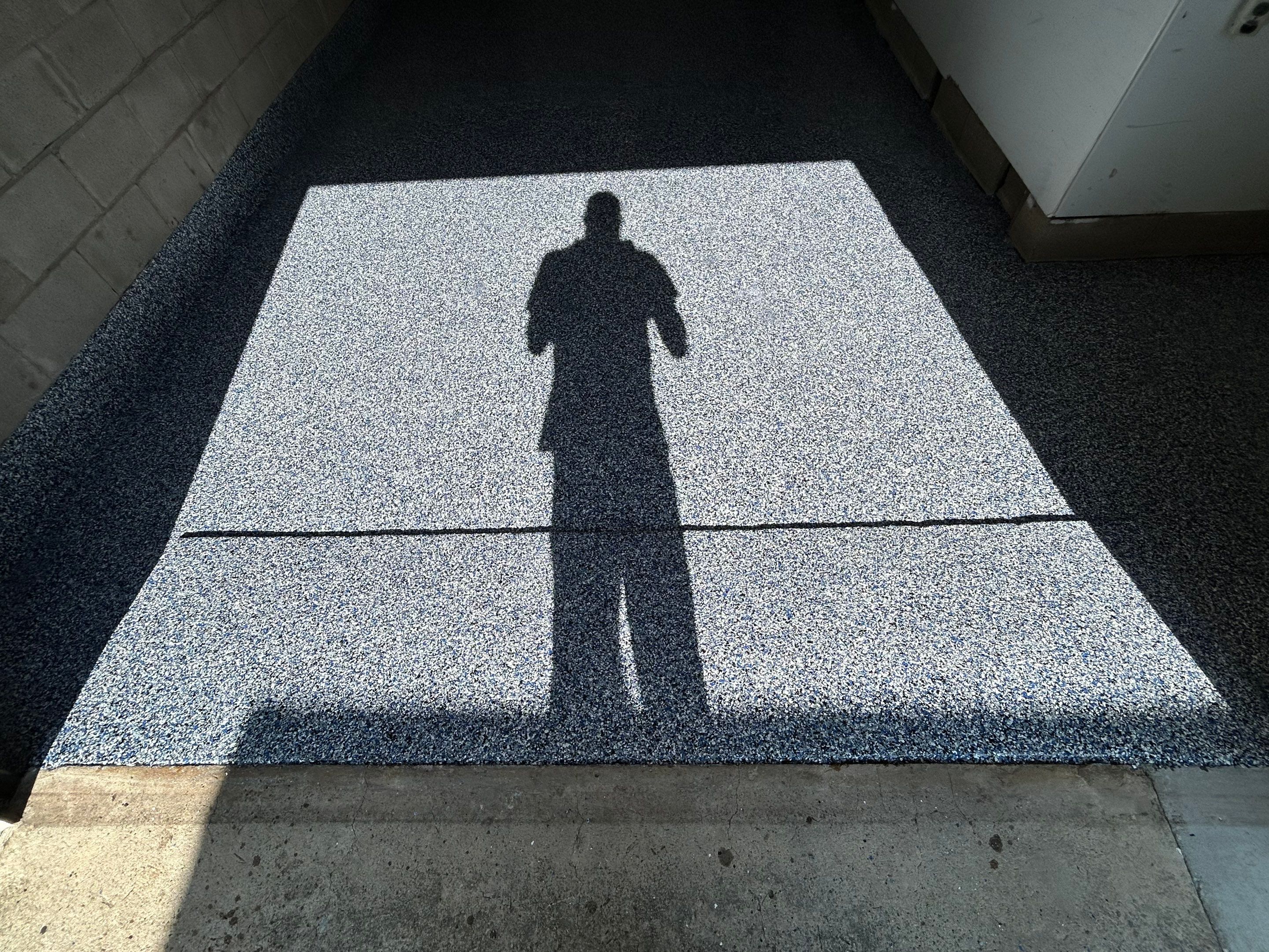 Garage Concrete Floor Coating Transformation by DiGiorgi Roofing and Siding Inc