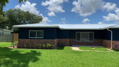 Residential Roofing Installation using 1" Nail strip metal roof