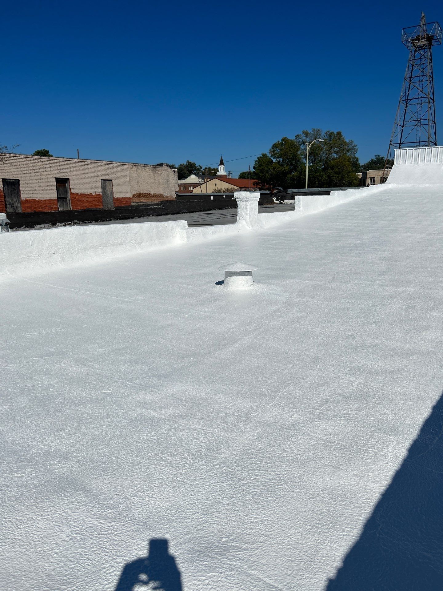 Downtown Gladewater Commercial Foam Roof Restoration – SPF + High-Tensile Acrylic by All Star Roofing LLC