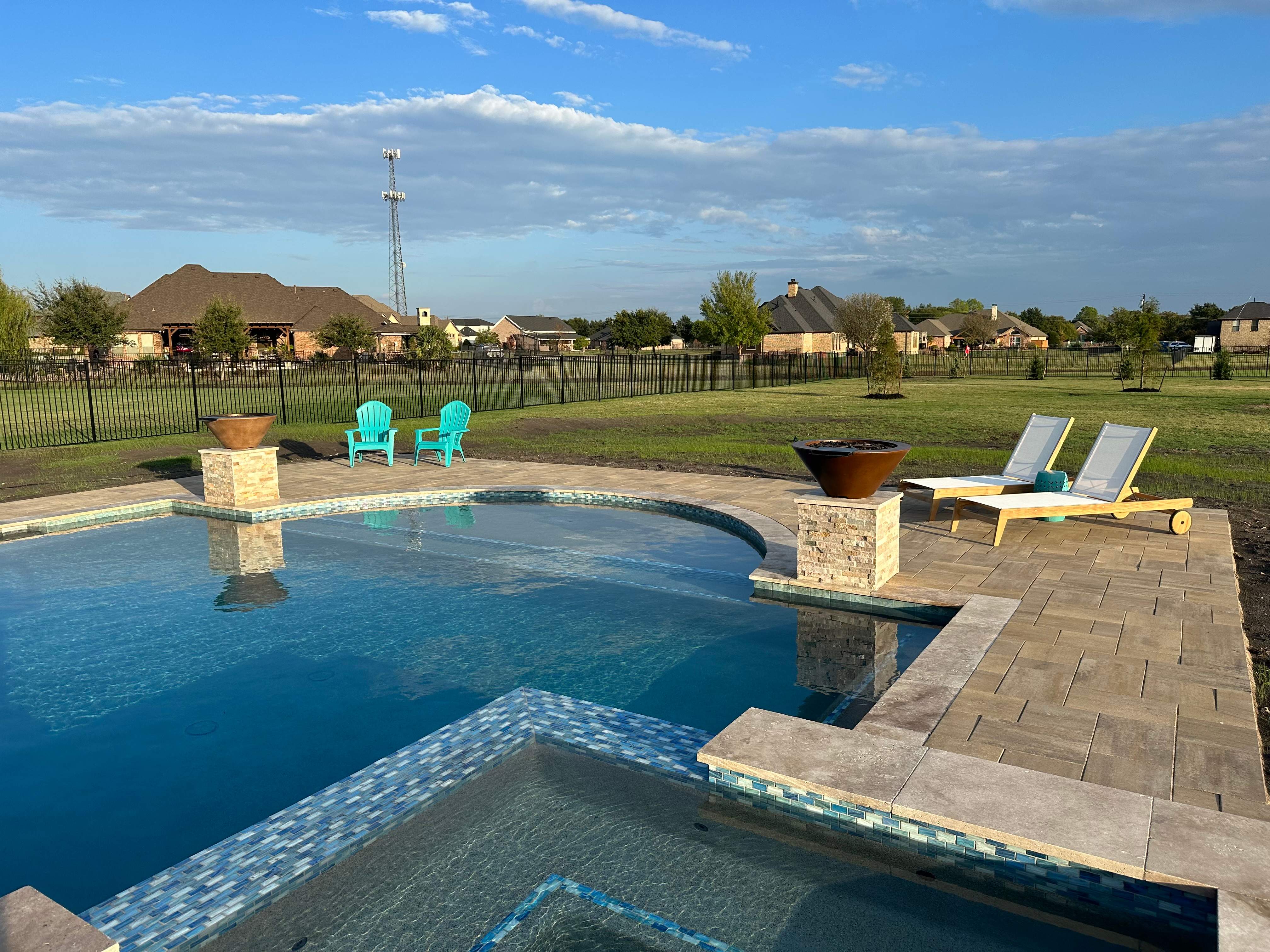 Freeform Pool and Spa with Travertine Decking and Bubblers by Pinnacle Pools and Spas - DFW