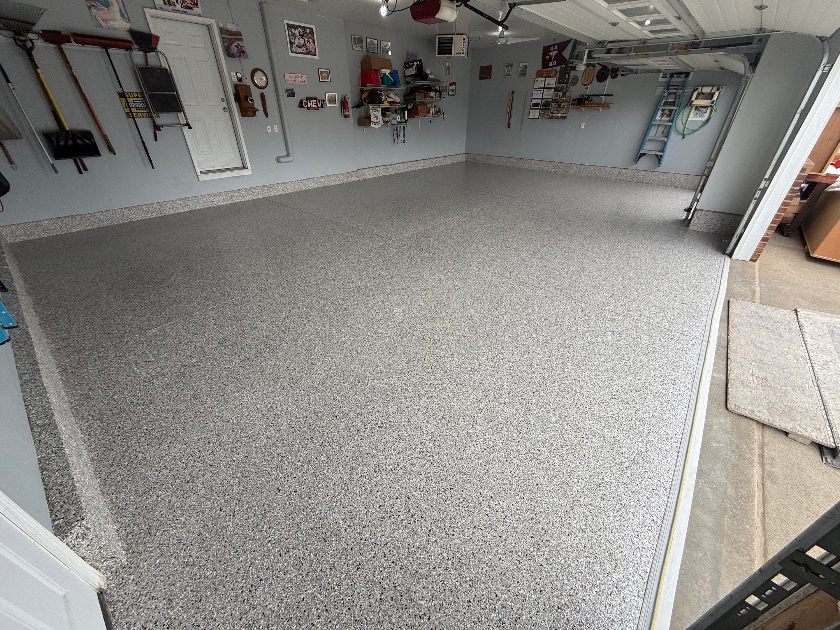 High-Gloss Epoxy Garage Floor Coating in Sioux Falls by Select Painting, Coatings & Garage Cabinets