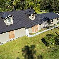 24ga 1.5" Mechanical Seam Dark Bronze  by Total Roofing System The Metal Roof Experts