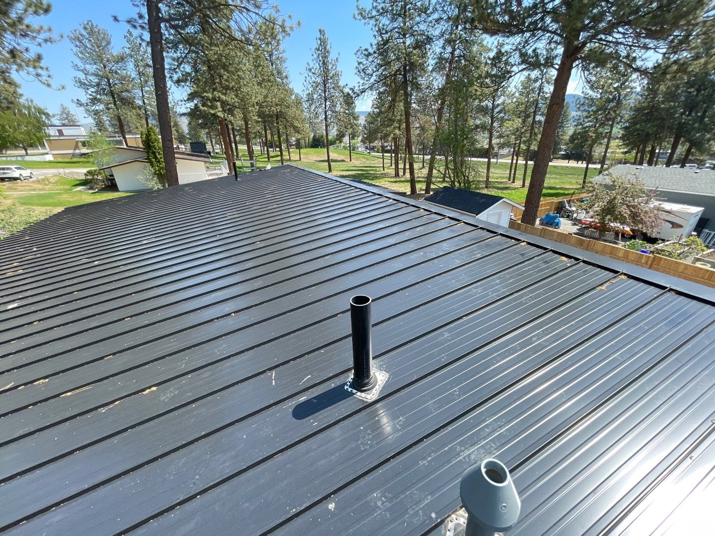 Residential Roofing Installation using 12" Prolok metal  by Top Notch Roofing Inc