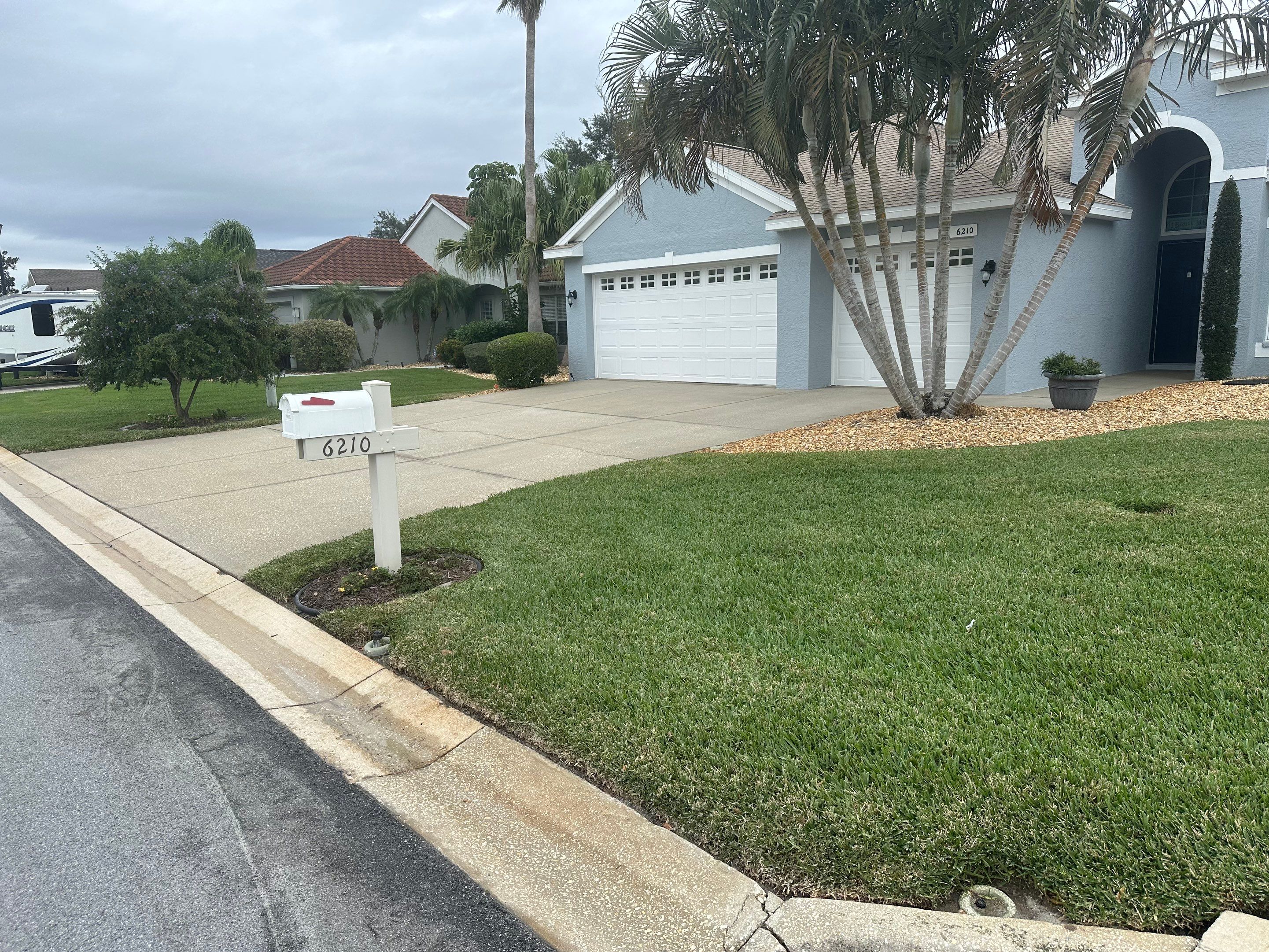 Concrete Driveway, Entryway & Street Curbing Cleaning in Fairways at Imperial Lakes, Palmetto, FL | Sunshine AquaWash by Sunshine AquaWash