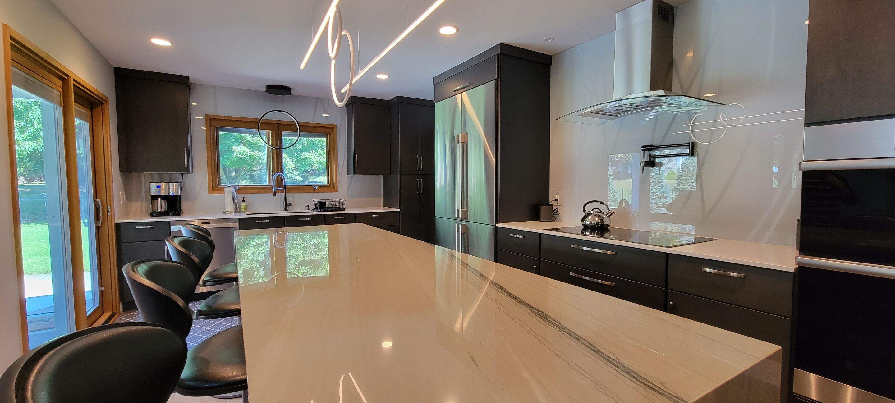 Kitchen Remodel using IMAGIO Misty Curves Solid Glass Backsplash by IMAGIO