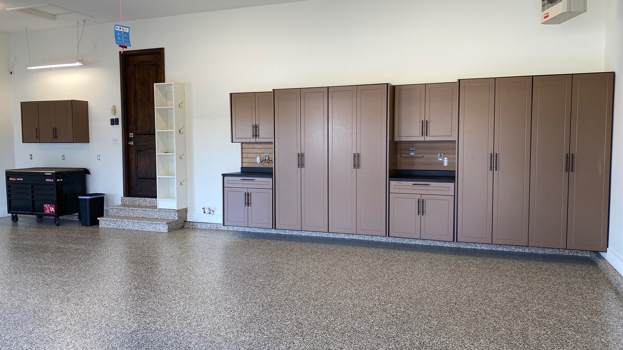 Kenny & Debbie transformed their garage with a Banner Garage Floor and cabinets by Banner Garage