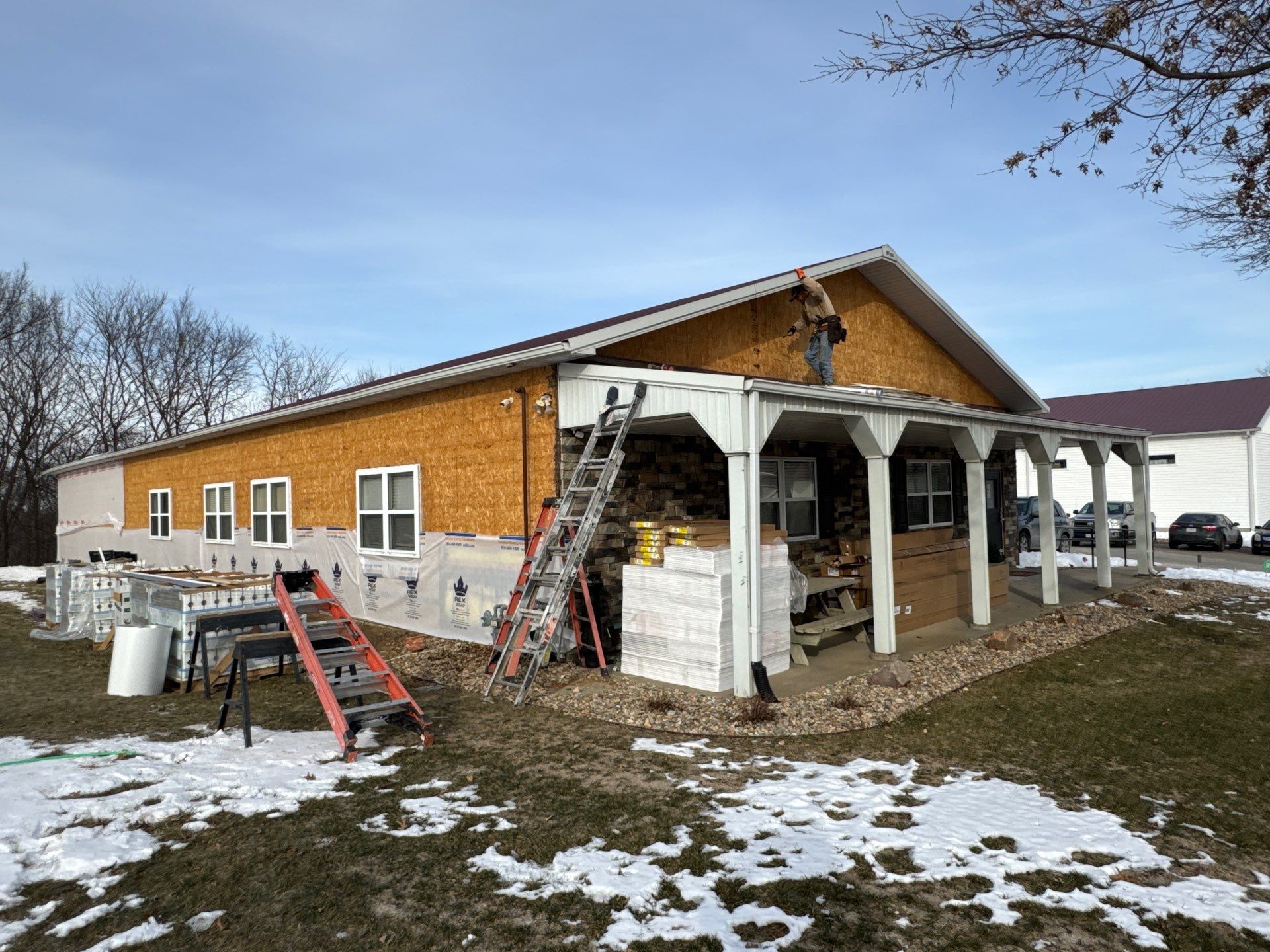 Siding and Stone Installation using Extrerior Porfolio Vinyl Siding and Versetta Stone by EEC  Windows, Siding & Roofing 