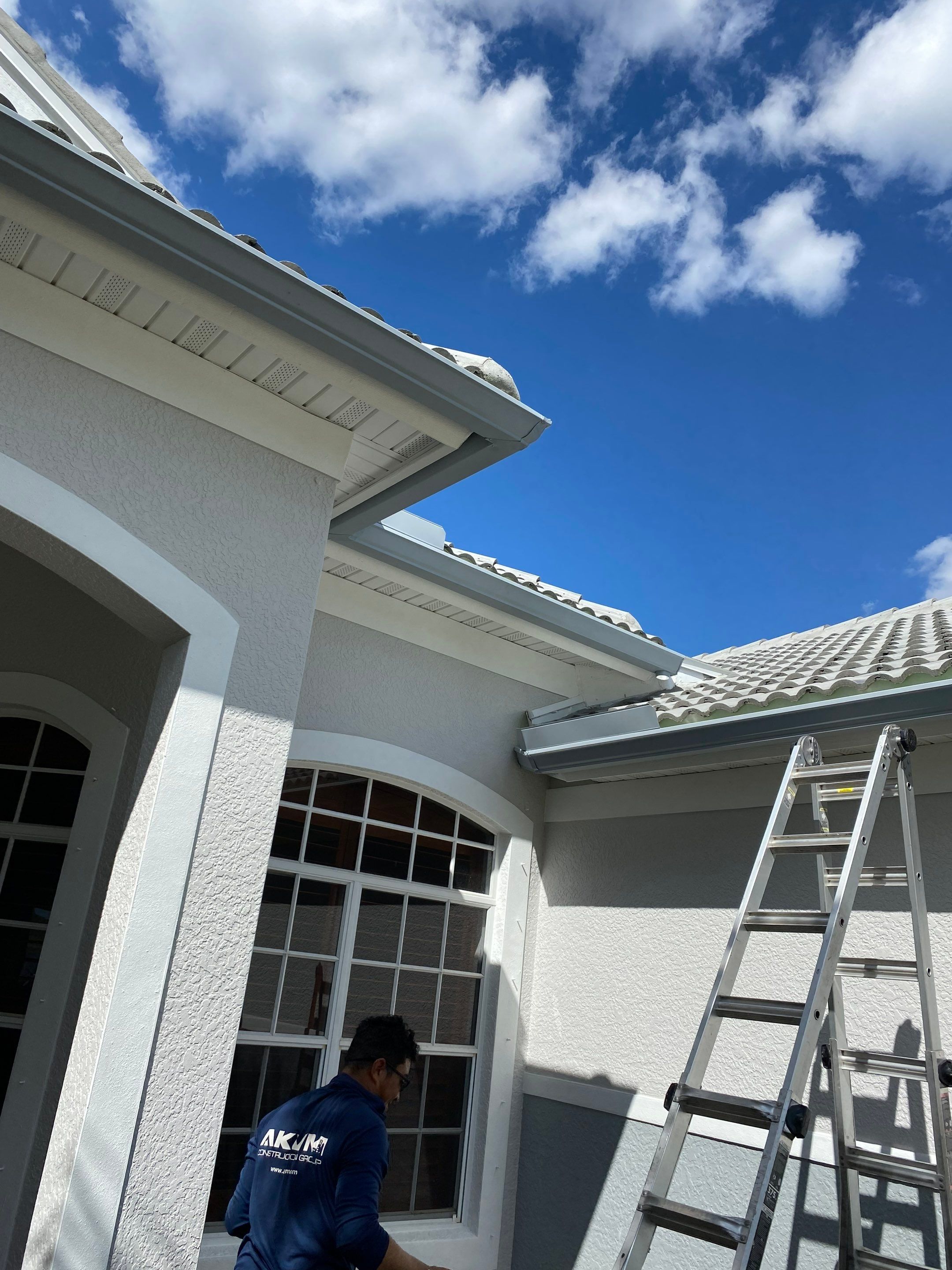 6-inch K-style Seamless Gutters and Splash Guard in Grey Color in Naples FL by Gutter Professors