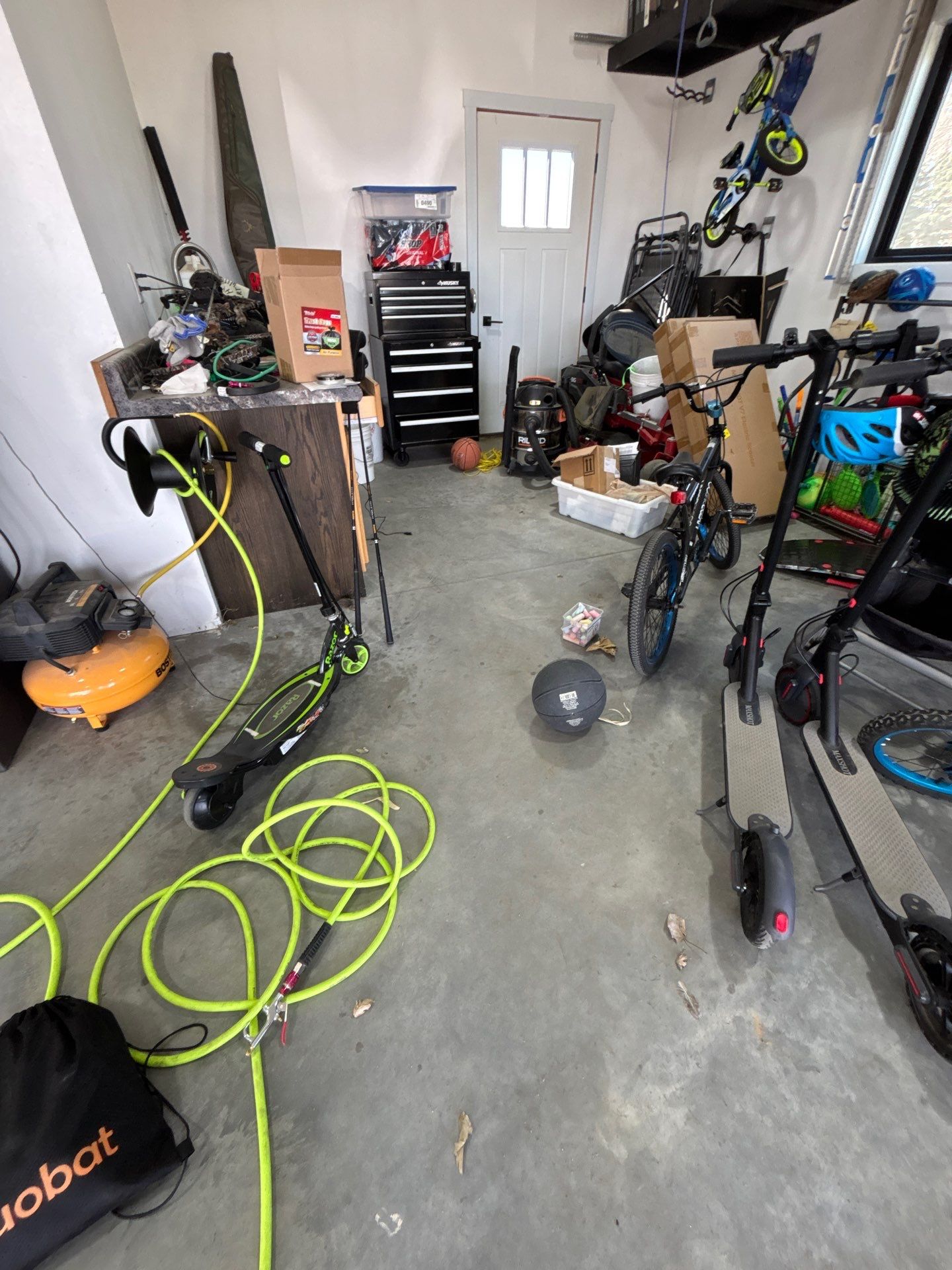 Speckled Polyaspartic Garage Floor Coating Installation in Dell Rapids by Select Painting, Coatings & Garage Cabinets