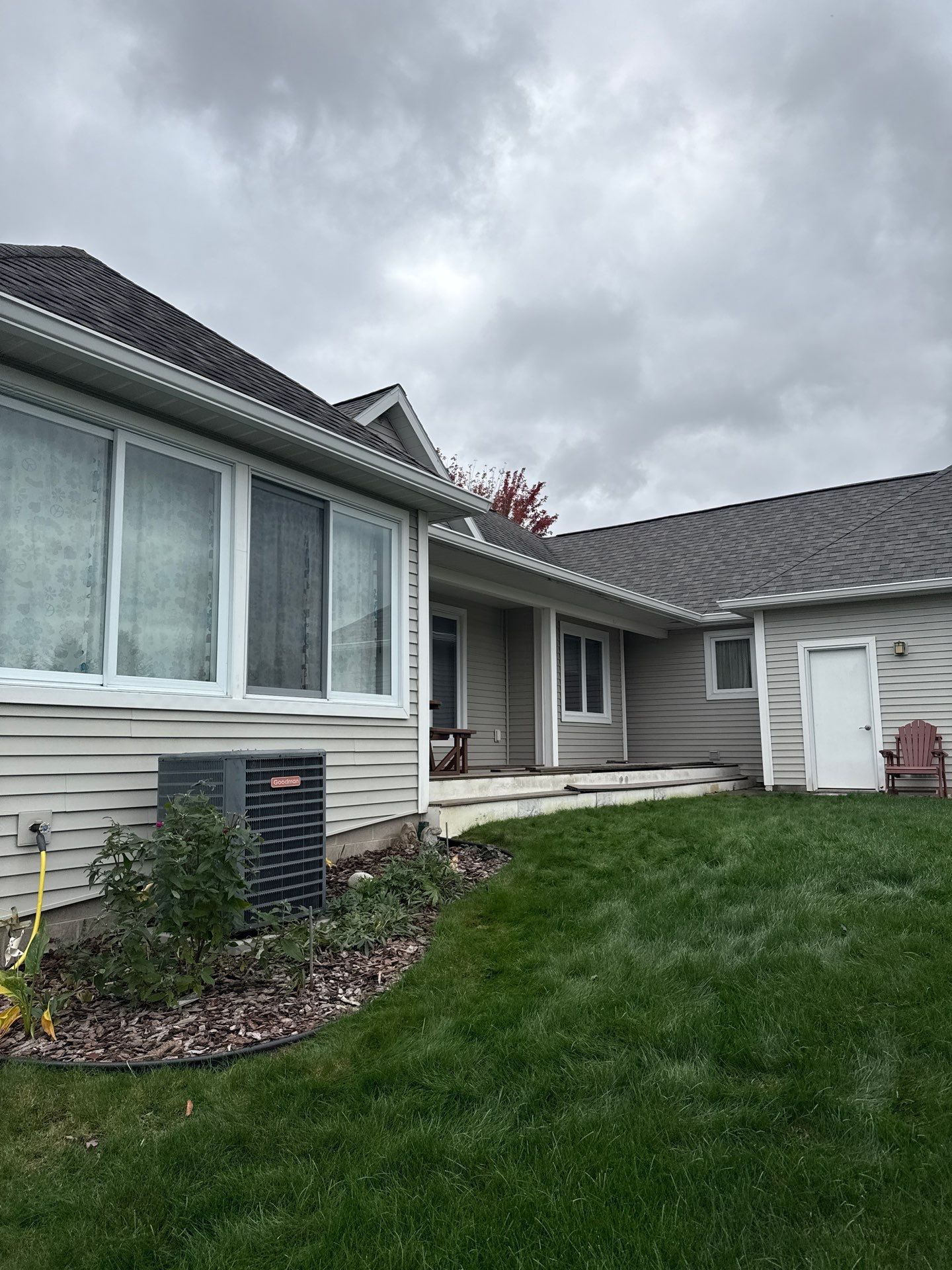 White Gutter System Installation for Traverse City Home by Rainbow Seamless Systems