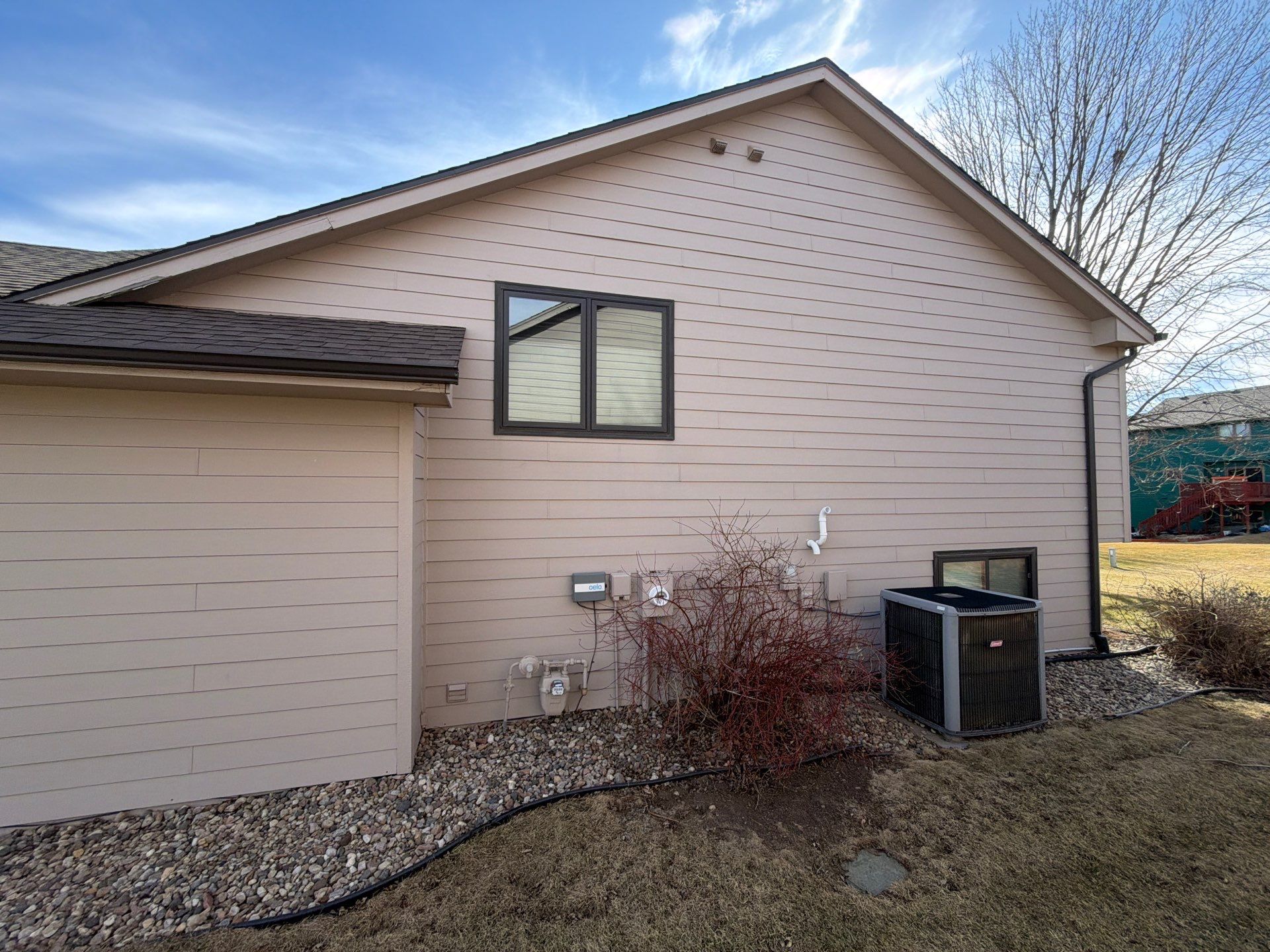 Residential Exterior Painting and Trim Restoration in Sioux Falls by Select Painting, Coatings & Garage Cabinets