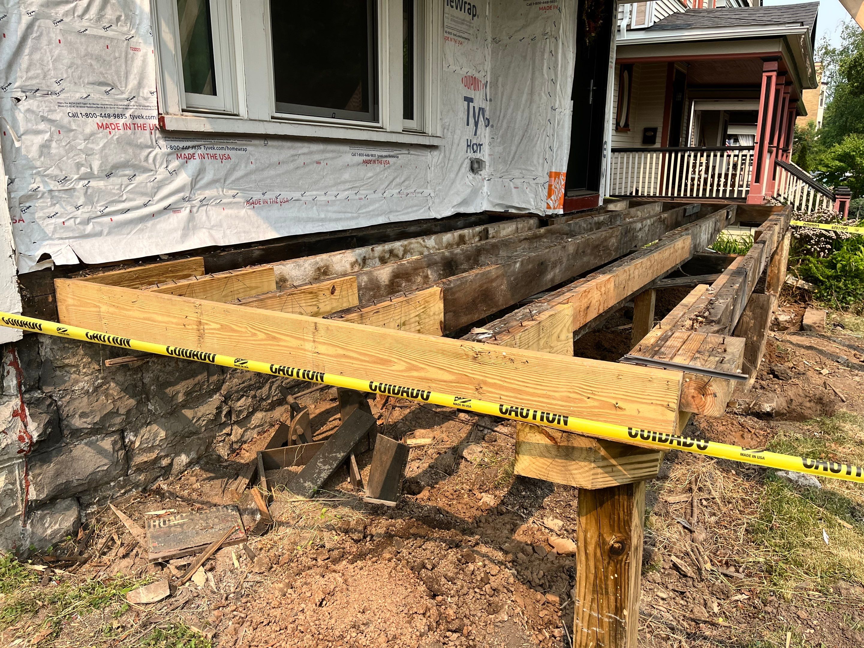 Exterior Renovations- Siding, Stamped Concrete, Porch, and Railings by Ivy Lea Construction