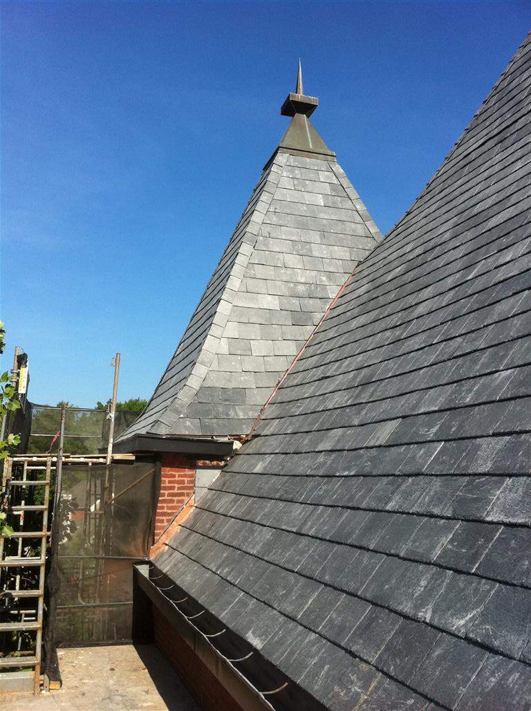 Historic Building ROOF REPLACEMNT with GAF TruSlate  on steep slop and Versico 60mil TPO on flat roof by Gorilla Exteriors Contracting, LLC