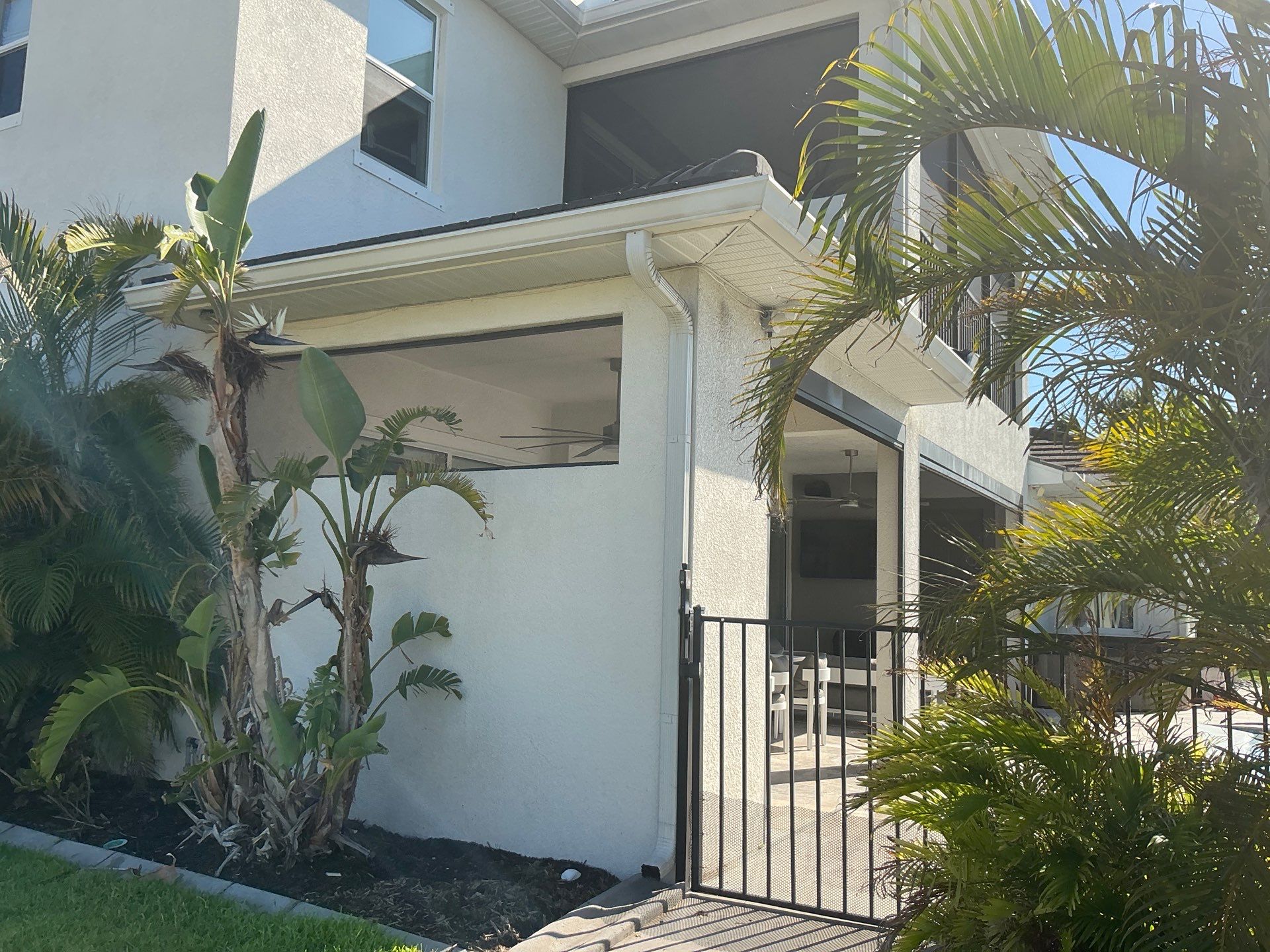 White Seamless Gutters with Downspouts in Bradenton FL by Gutter Professors