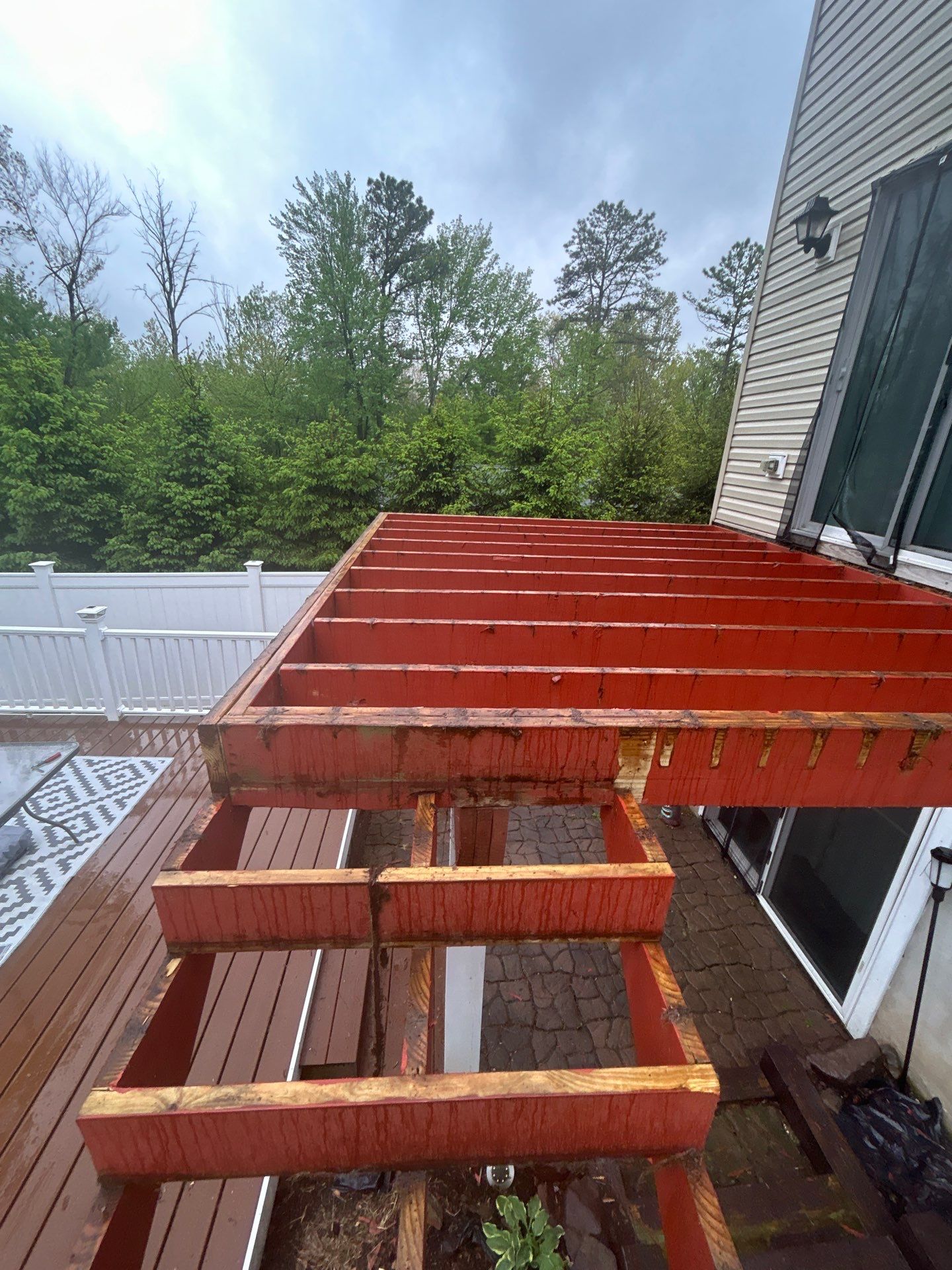Elevated Composite Deck Replacement with White Railing in Tannersville by Herts Roofing & Construction