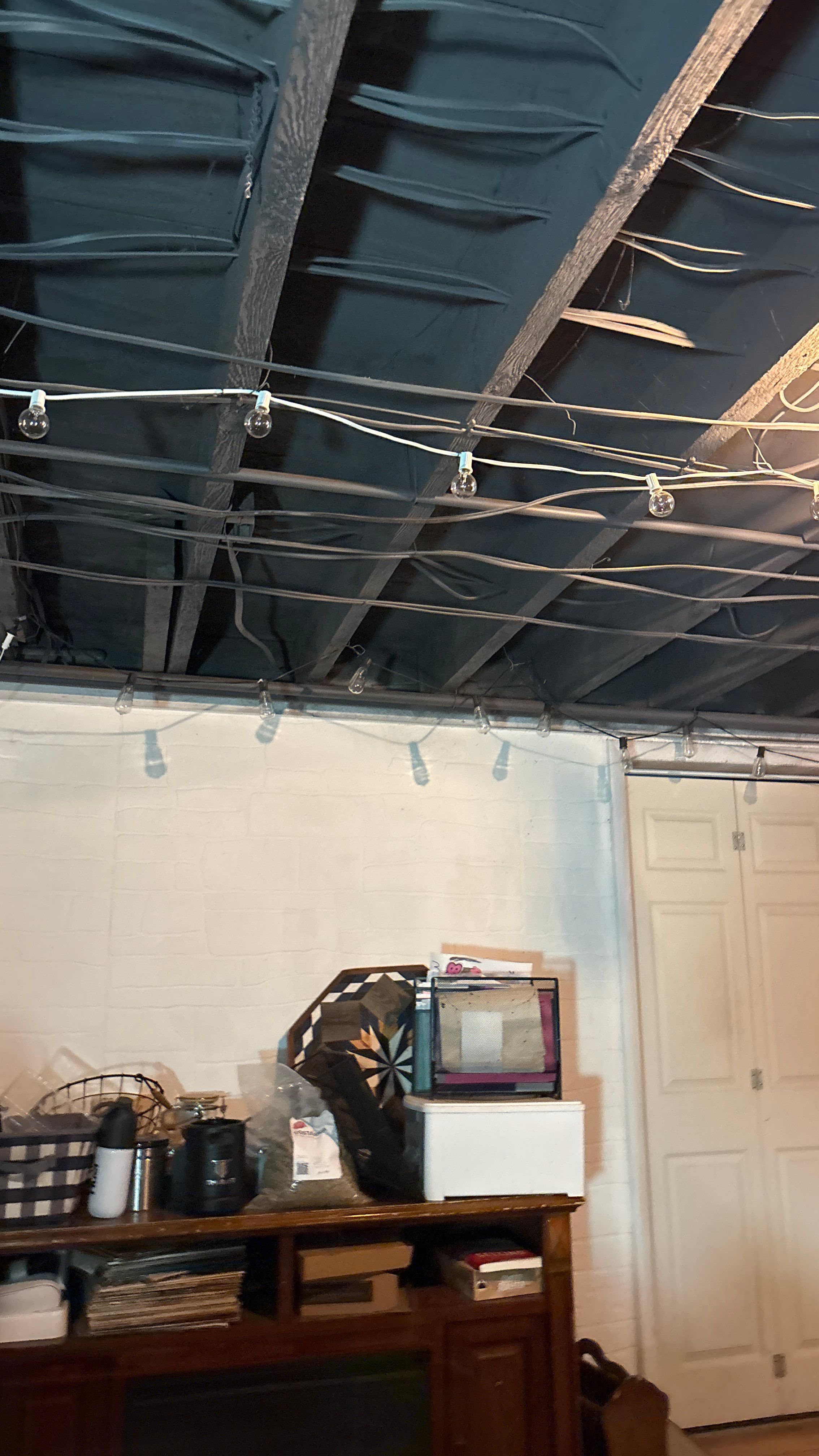 Wanamingo Basement Renovation with Dark Painted Ceiling Joists by CompanyCam Sales Demo