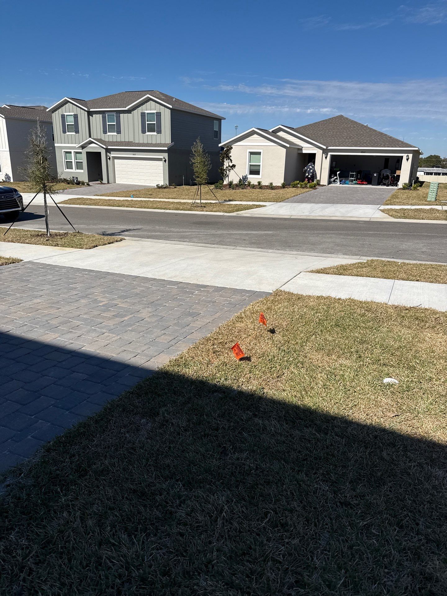 White Down Spouts and Seamless Gutters using downspouts in Dade City FL by Gutter Professors