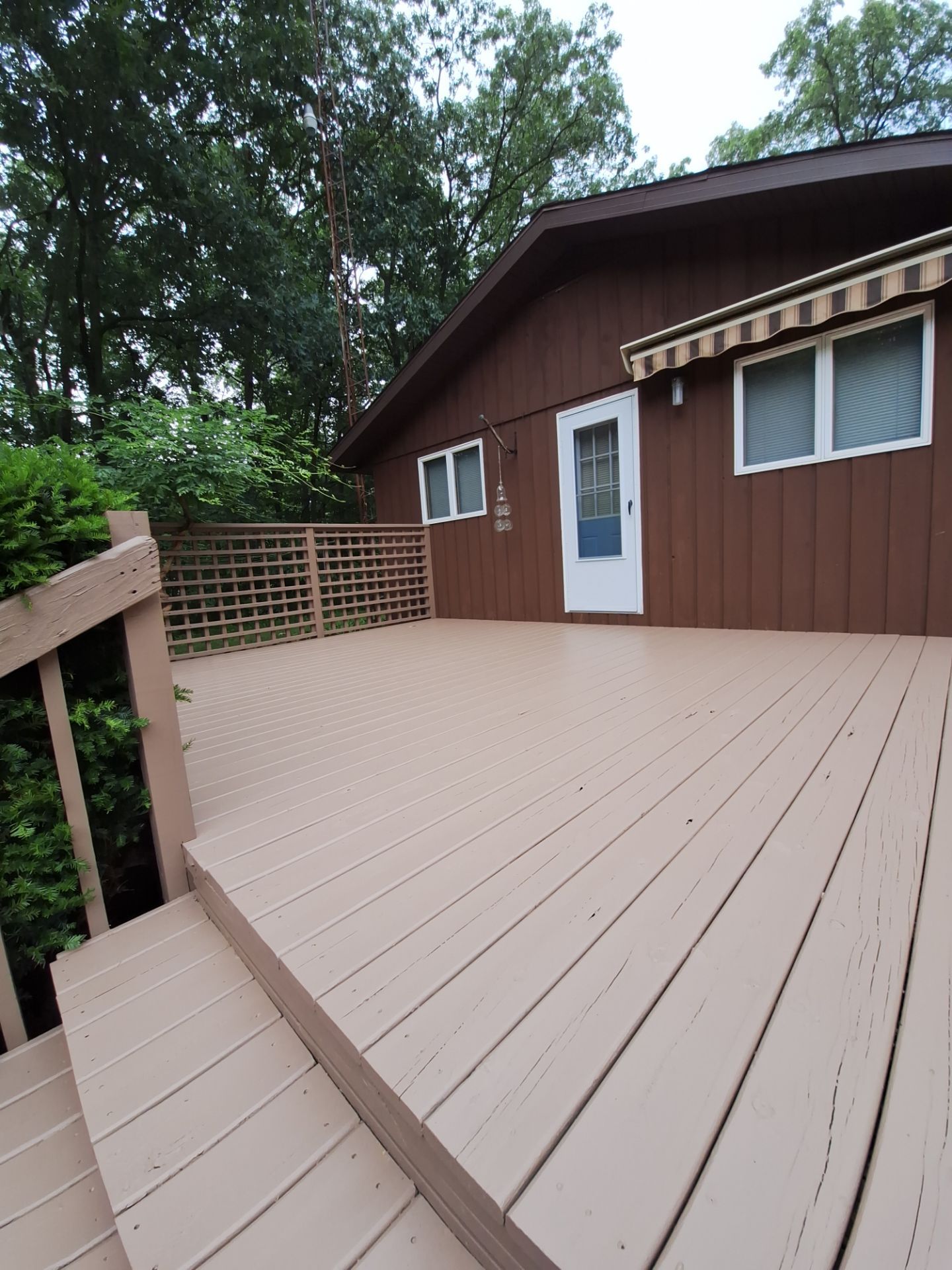 Muskegon Deck Restoration with Pressure Treated Railings and Wood Staining by Gordon Painting