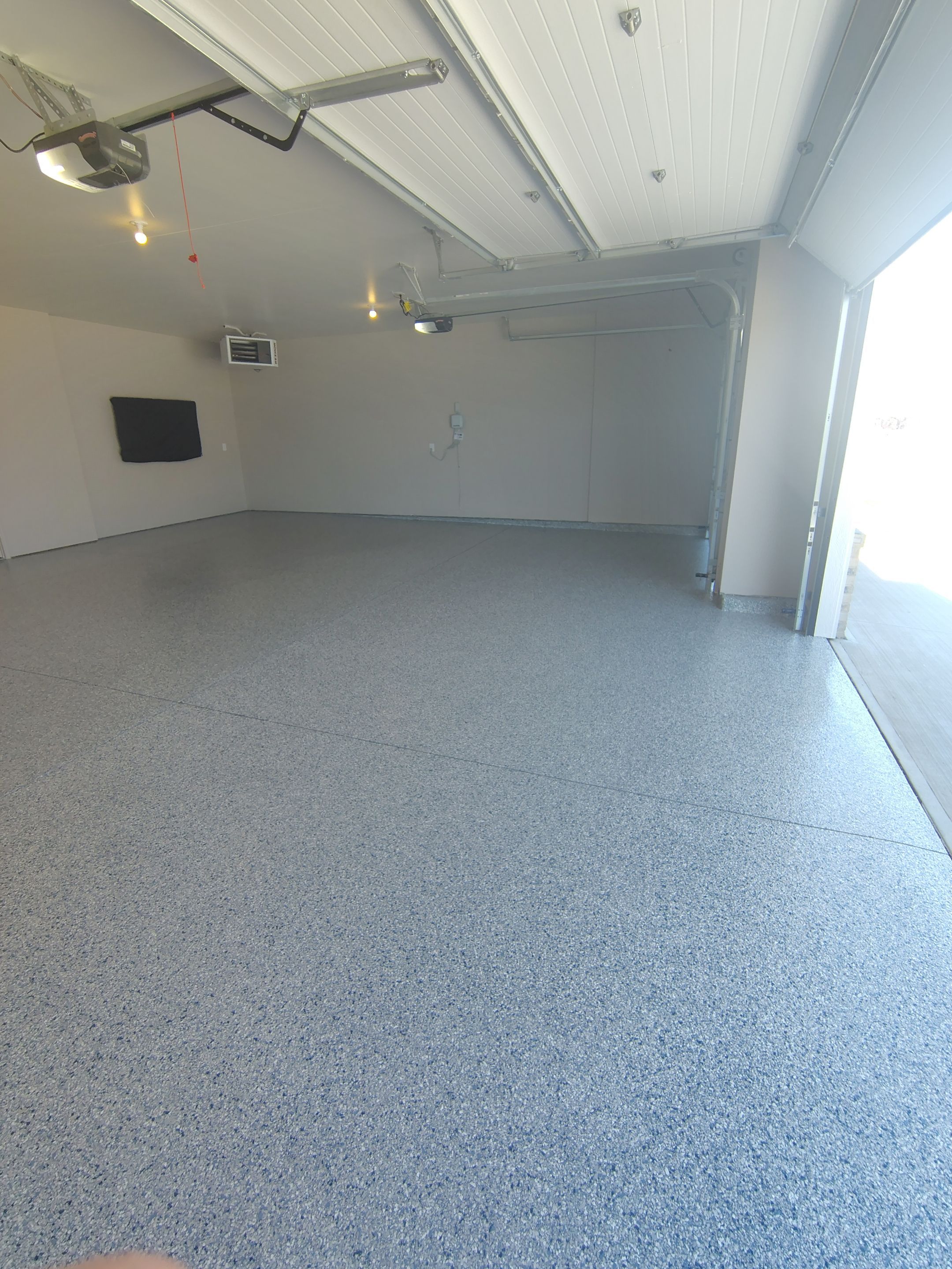 Full Speckled Concrete Coating for Sioux Falls Garage by Select Painting, Coatings & Garage Cabinets