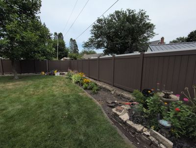Walnut Vinyl Privacy Fence Installation in Waterloo