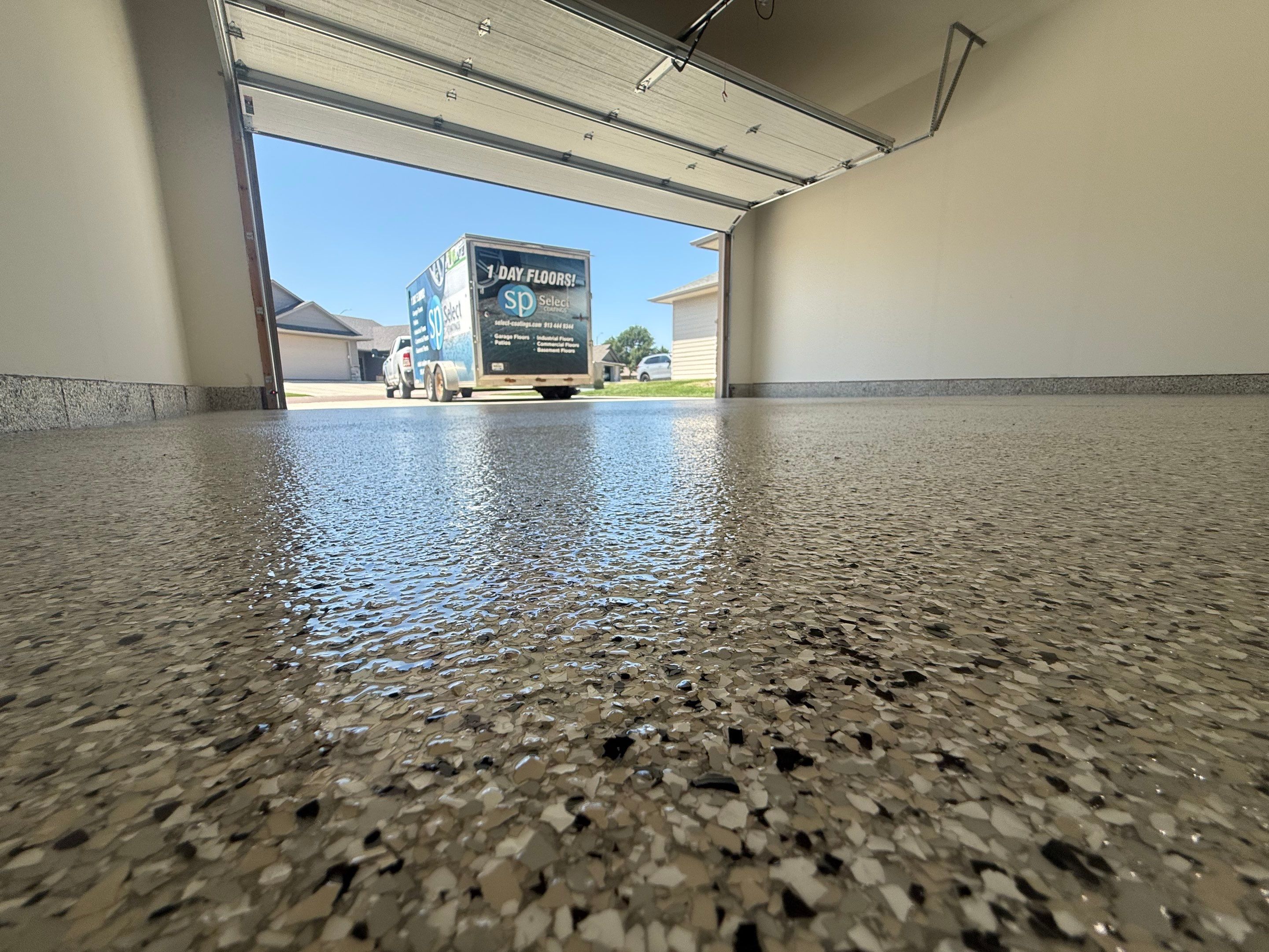 Cabin Fever Garage Floor Coating in Sioux Falls by Select Painting, Coatings & Garage Cabinets