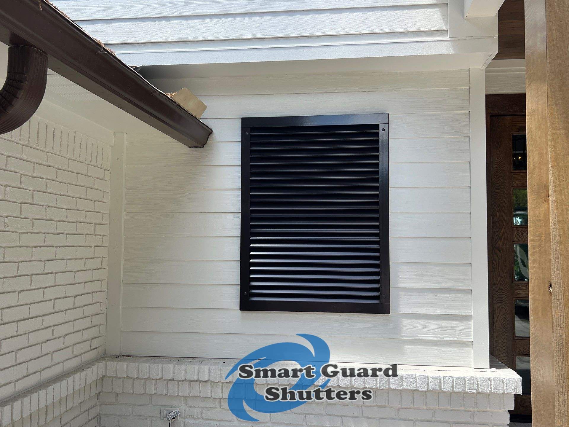 Impact Colonial & Bahama Shutters in Jet Black by Smart Guard Shutters