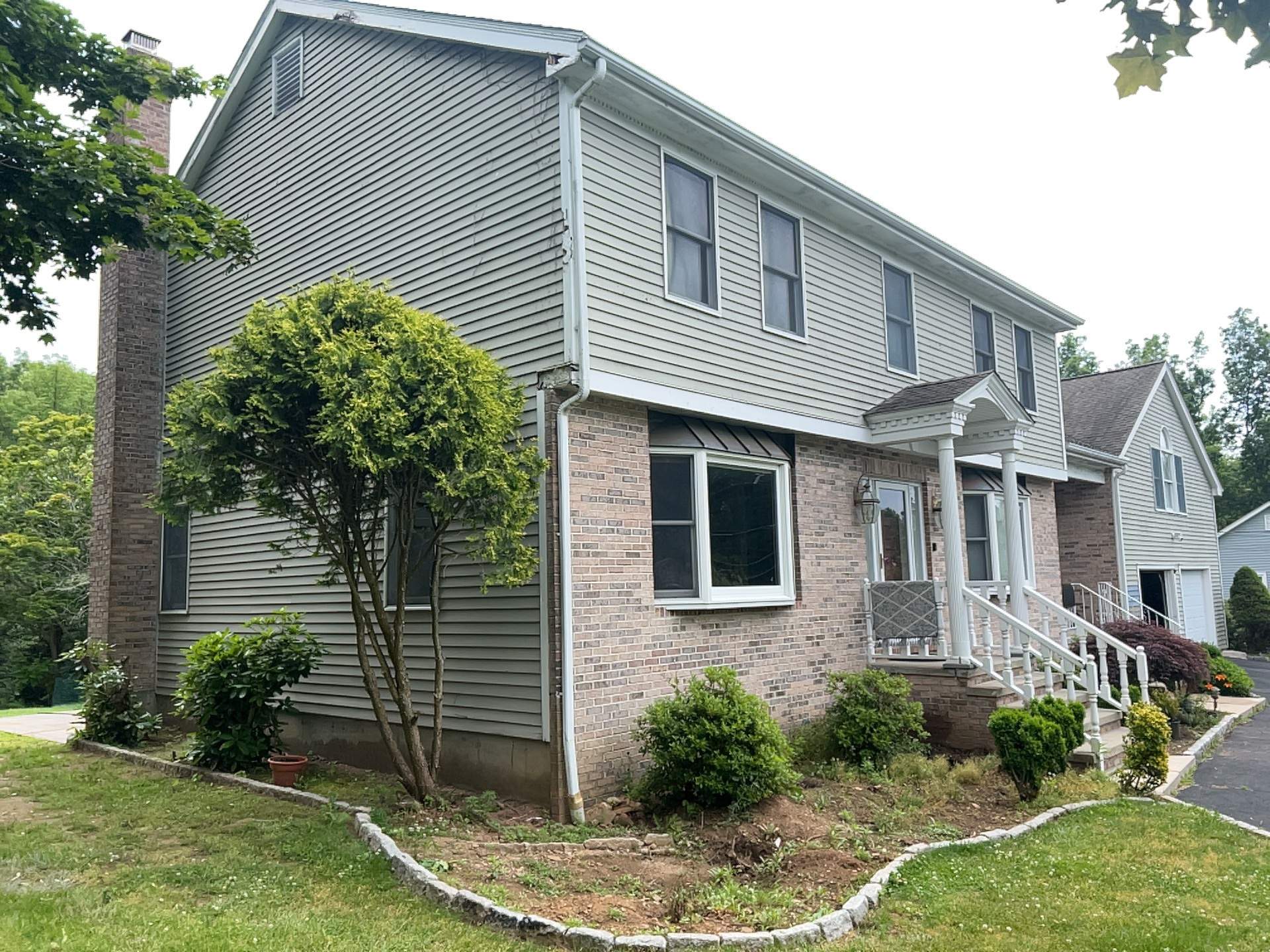 Siding Installation using Mainstreet Colonial & White gutters by A Plus Exterior