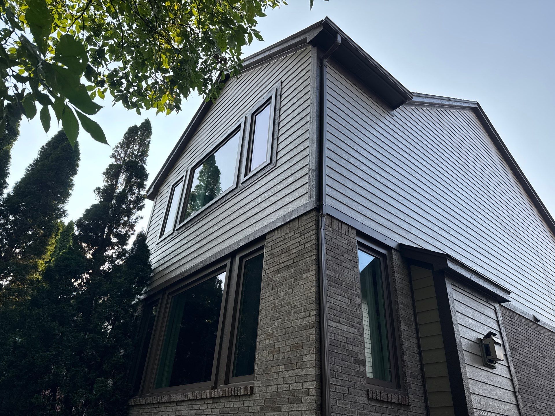 Exterior Wood Trim and Siding Replacement in Rochester by Top Shelf Painter