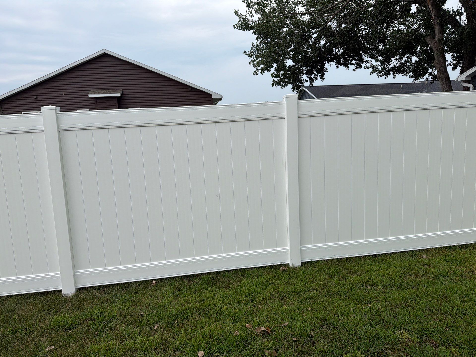 White Vinyl Privacy Fence and Double Gate Installation in Jesup by Perfect Picket Fence and Stain