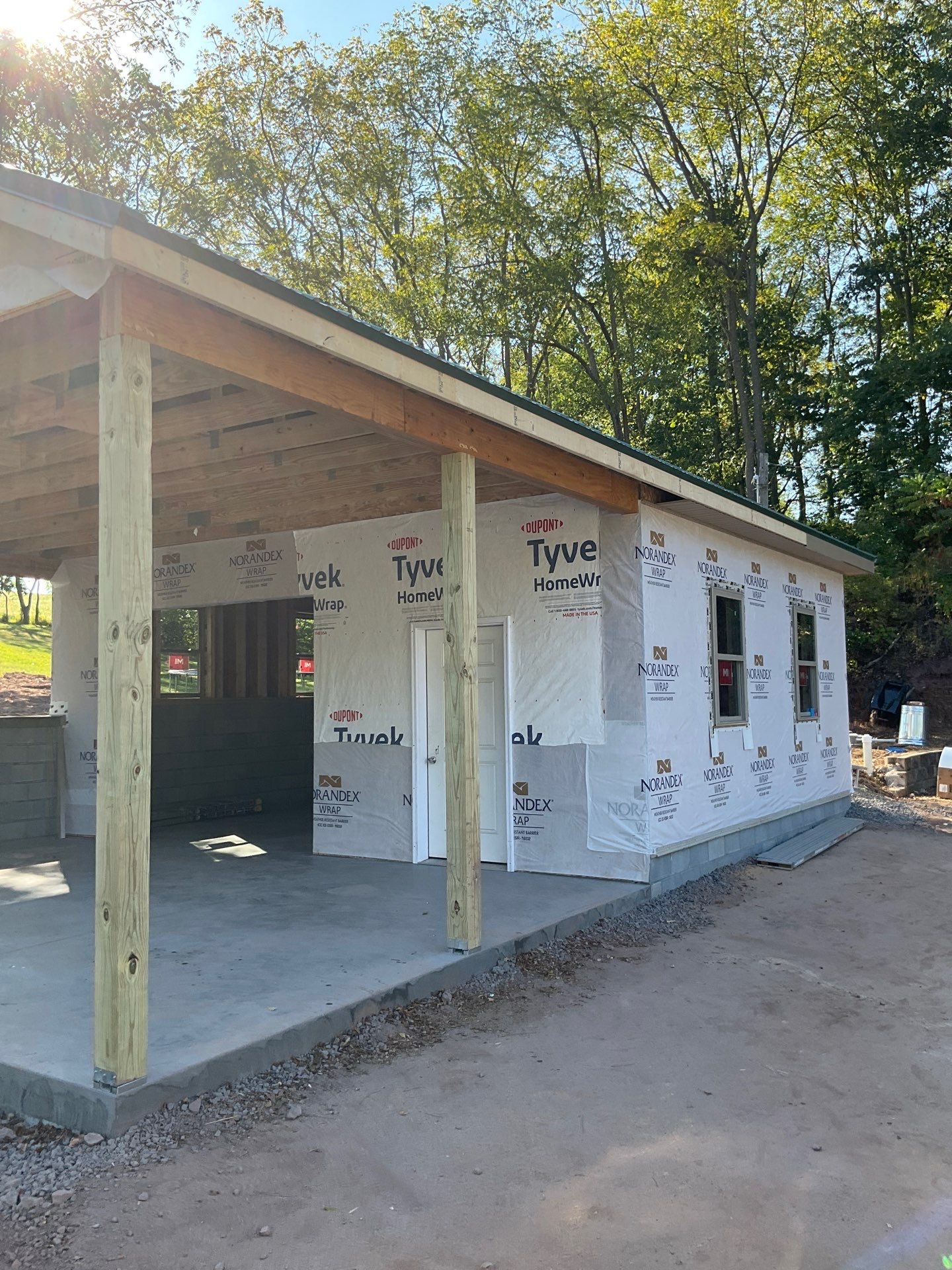 Detached Garage Construction with Vinyl Siding and Metal Roof by Esh Builders