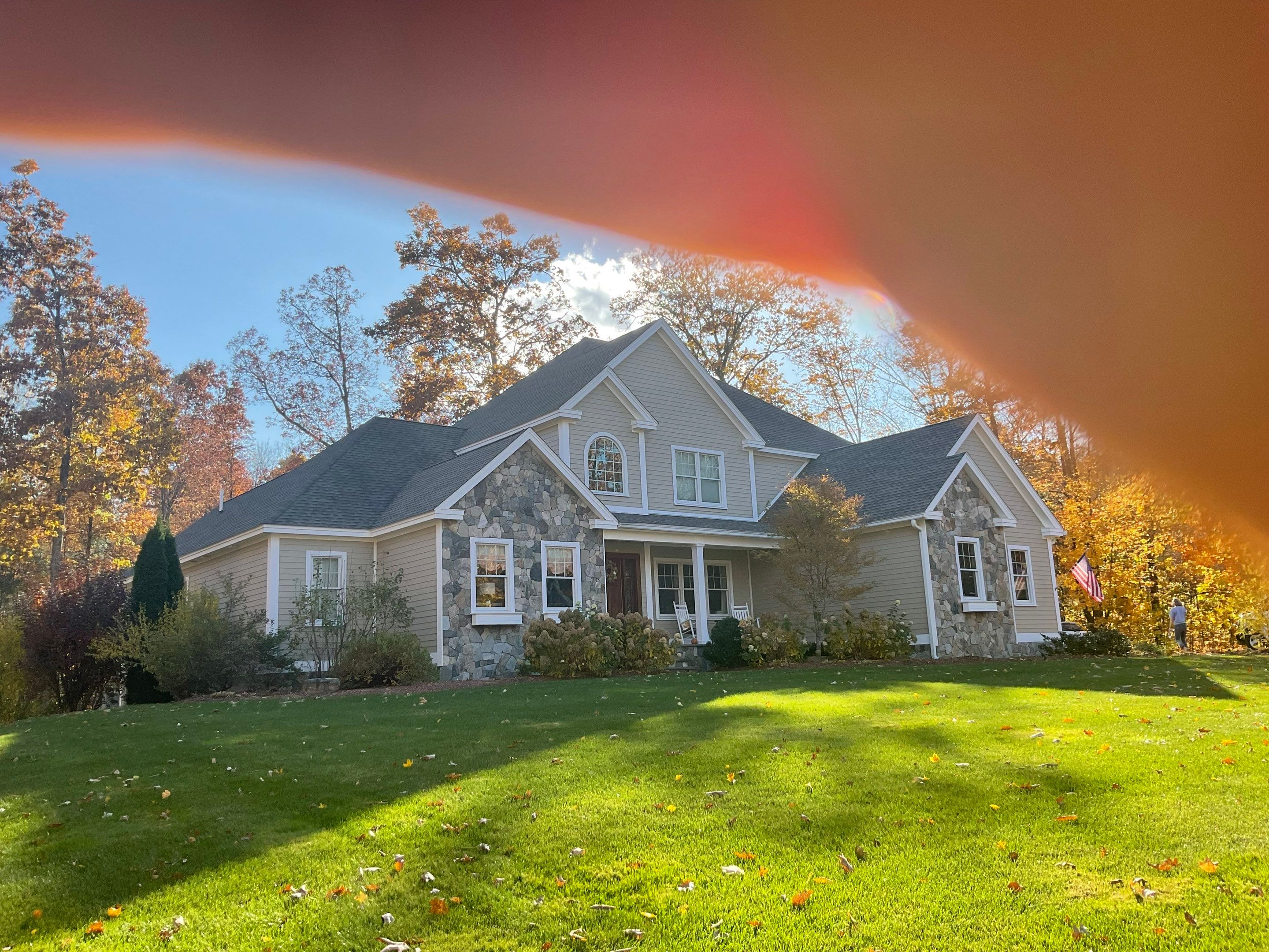 the service shown is cleaning the exterior surfaces of a house including siding and windows for a fresh appearance