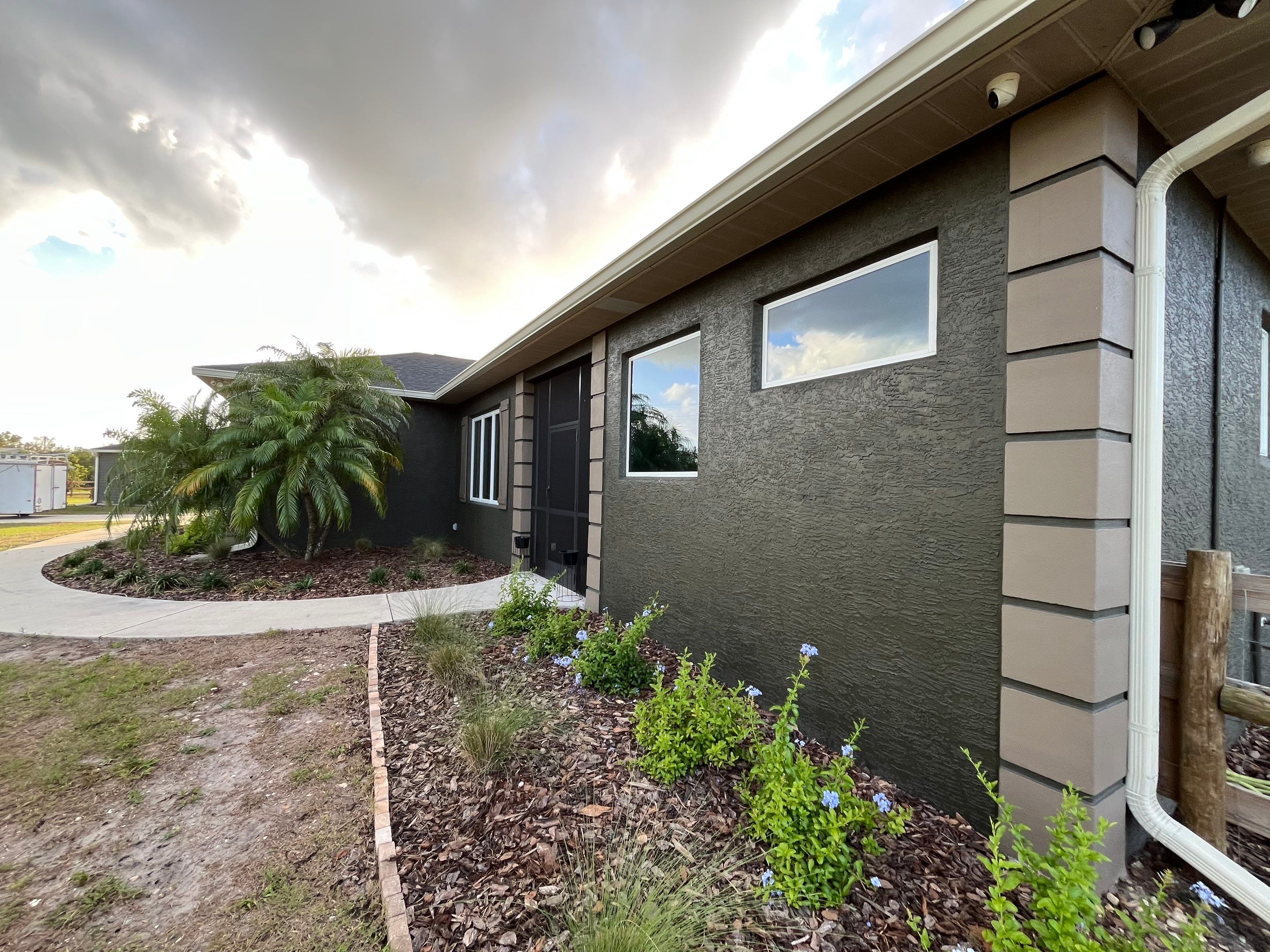  7-inch White seamless gutters and downspouts in Myakka City FL by Gutter Professors
