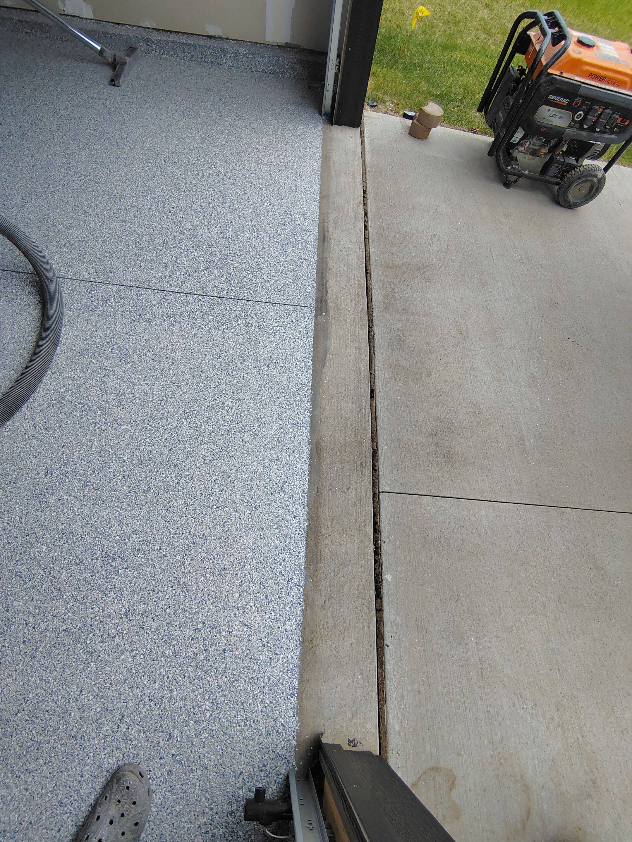 Custom Epoxy Garage Floor Coating Installation in Sioux Falls by Select Painting, Coatings & Garage Cabinets