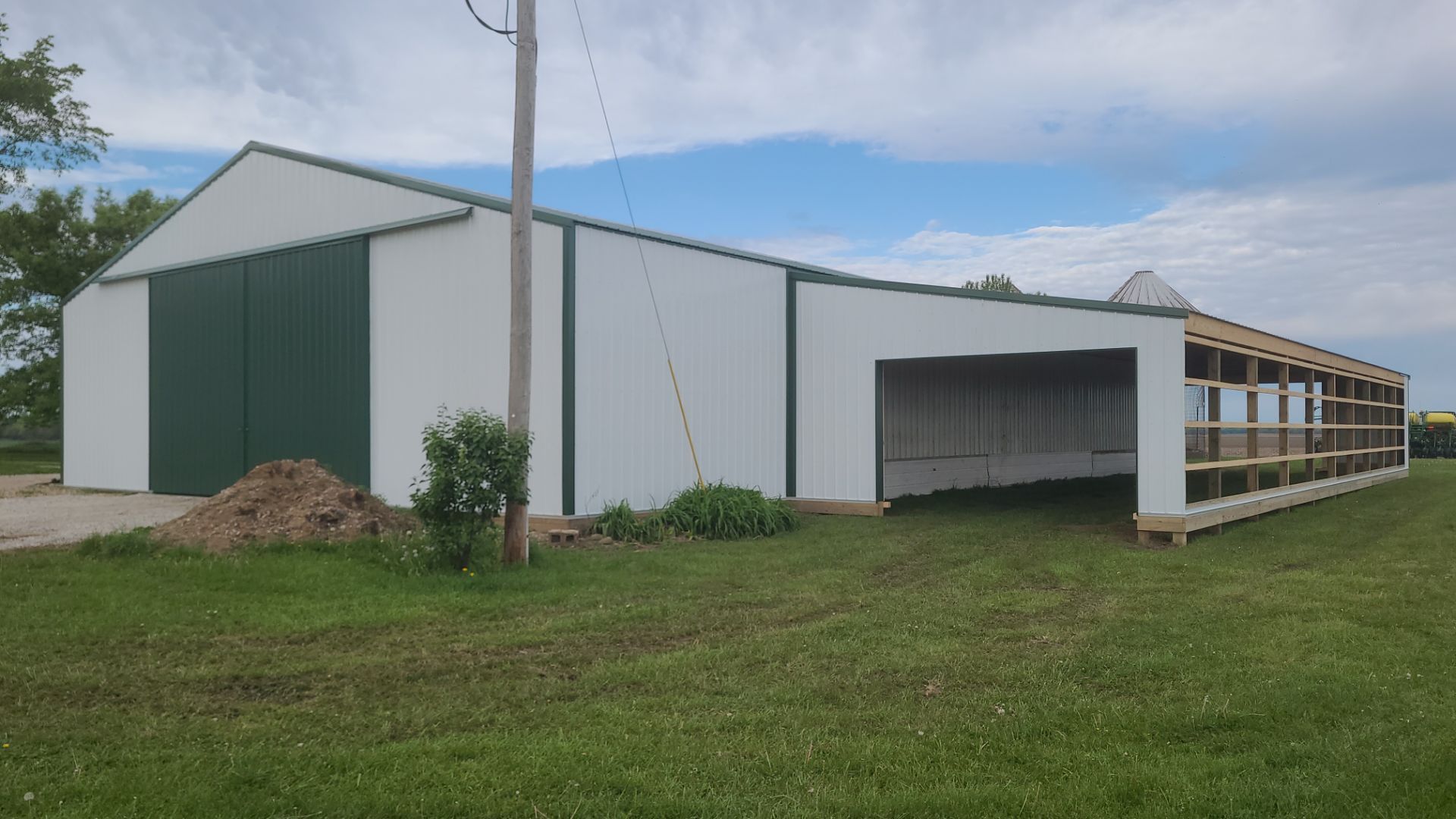 Reskin pole barn and add lean-to by Dagny Builders