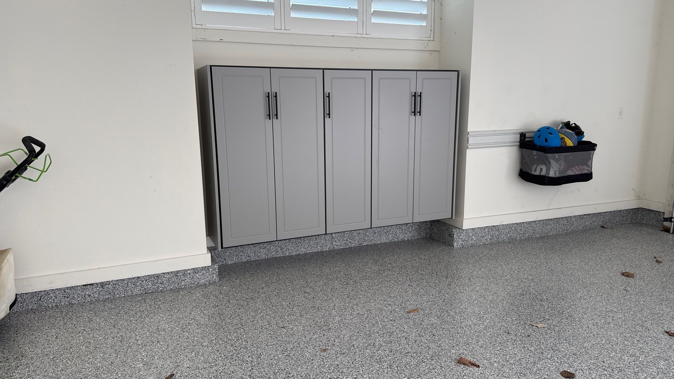 Nick's New Floor & Storage Looks Beautiful by Banner Garage