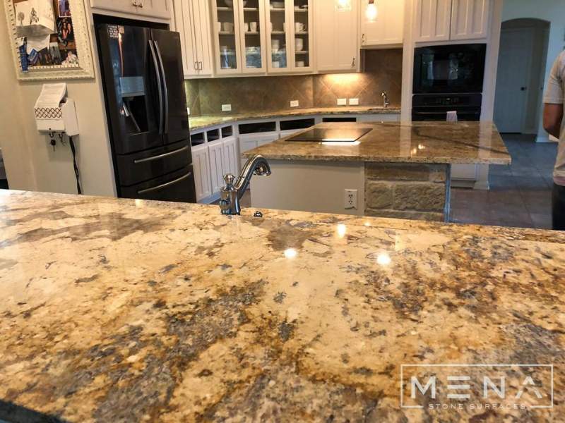 Kitchen countertops using Yellow River Granite  by Mena stone surfaces