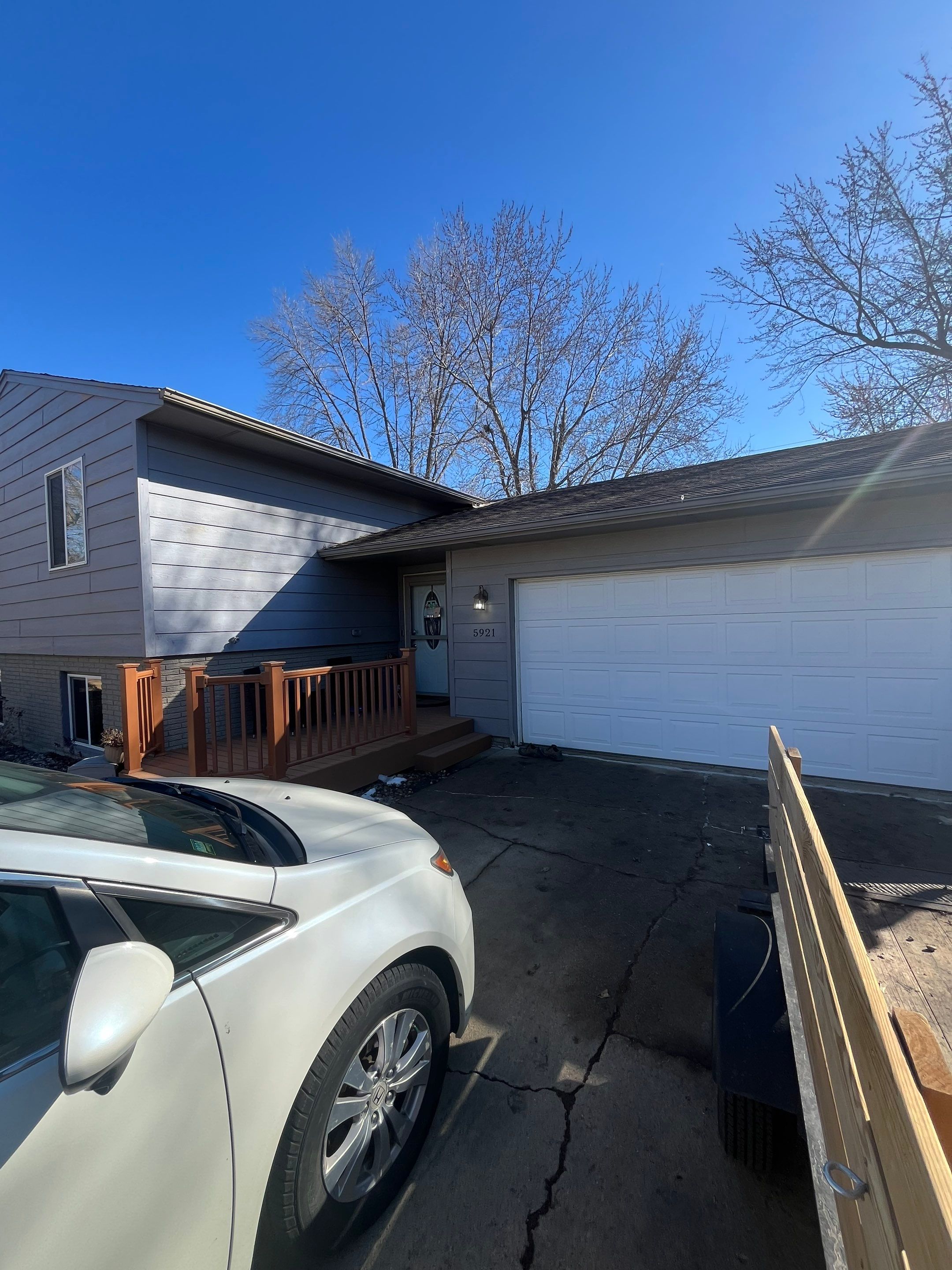 Full Exterior House Painting and Foundation Refinishing in Sioux Falls by Select Painting, Coatings & Garage Cabinets