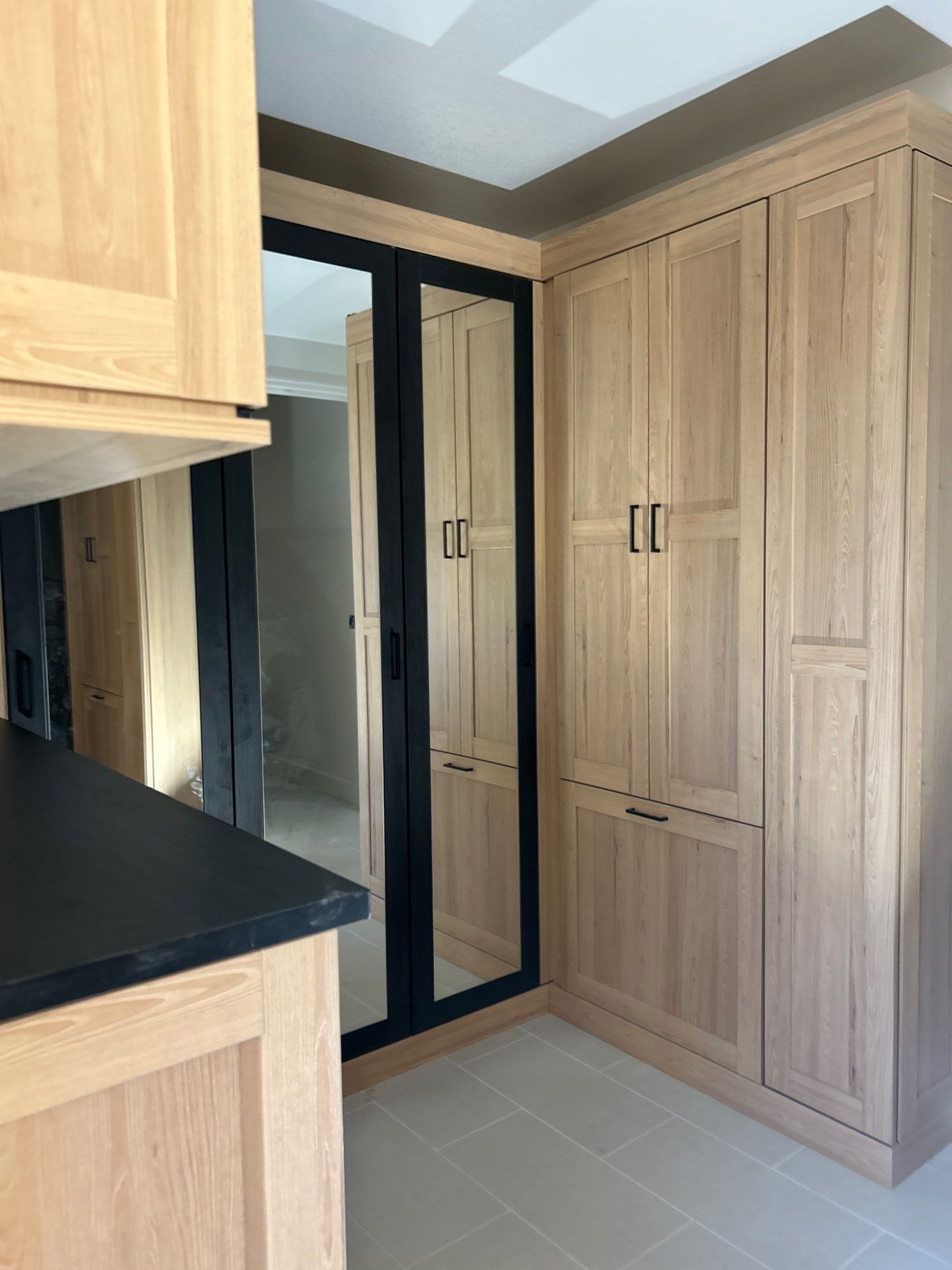 Two-Tone Closet with matching Mudroom + Laundry Room by Concept 32, Inc.
