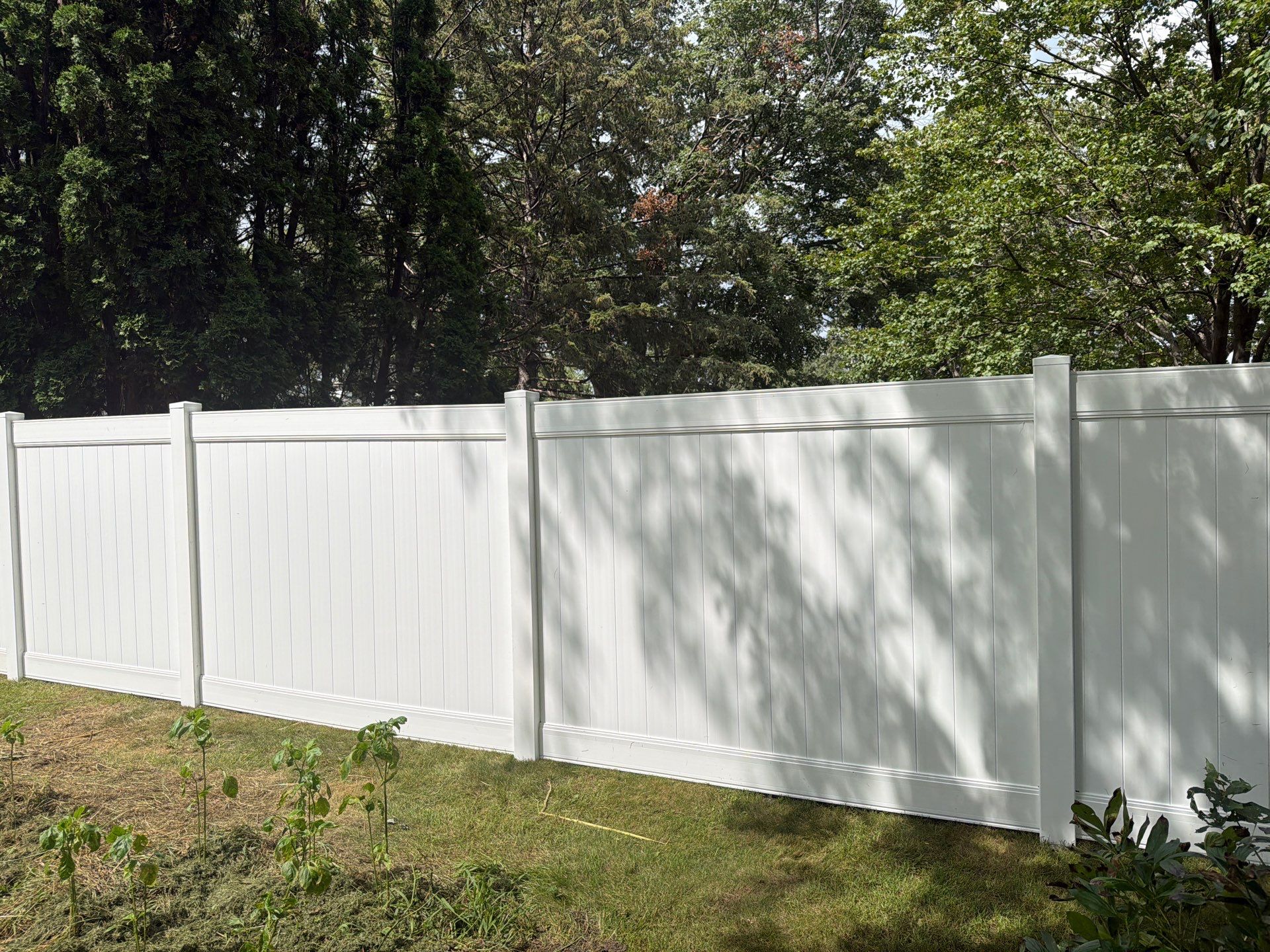 Residential White Vinyl Privacy and Black Chain Link Fencing in Jesup by Perfect Picket Fence and Stain