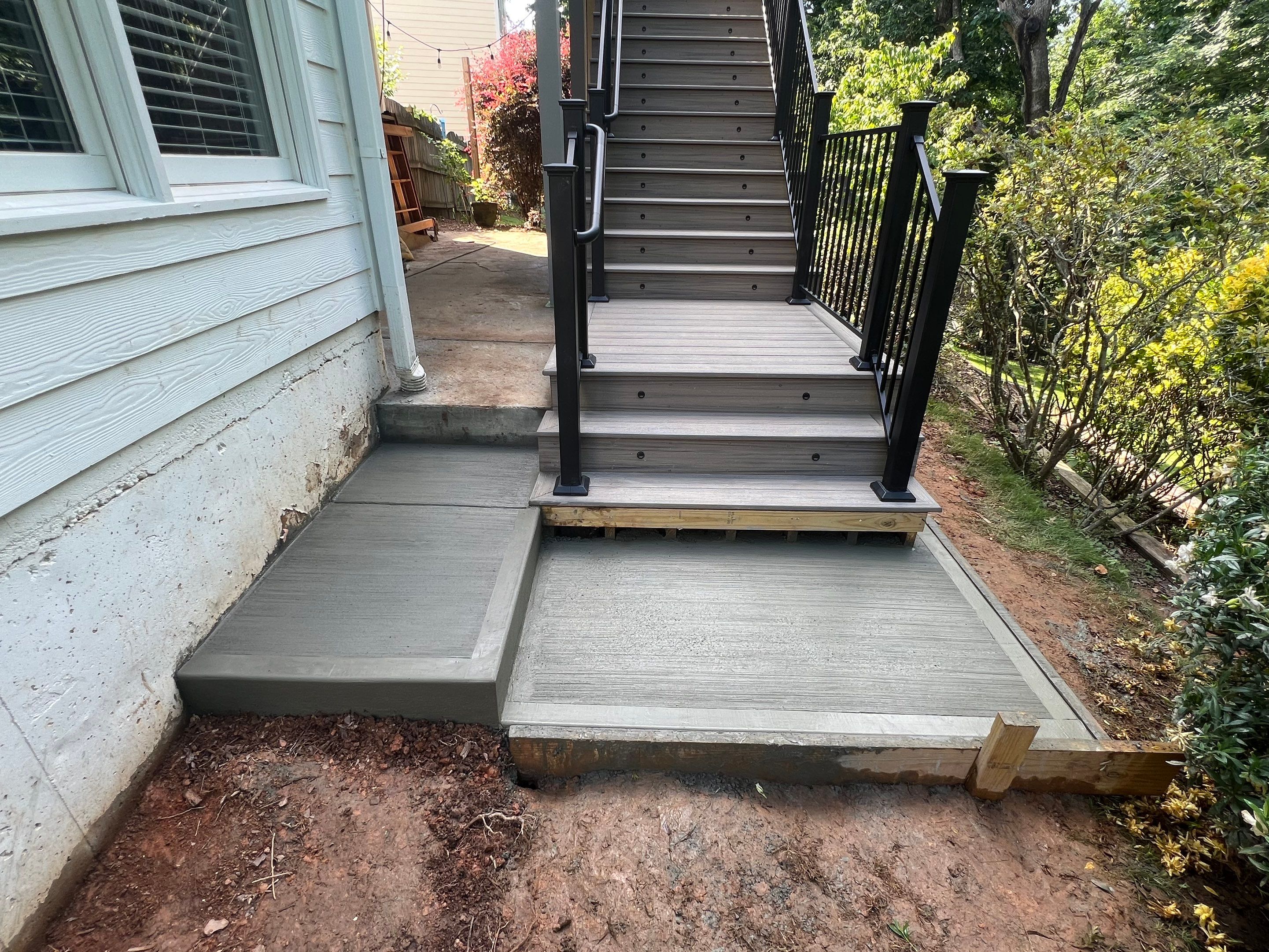 Elevated Composite Deck and Concrete Landing Installation in Kennesaw by Swift Home Renovations