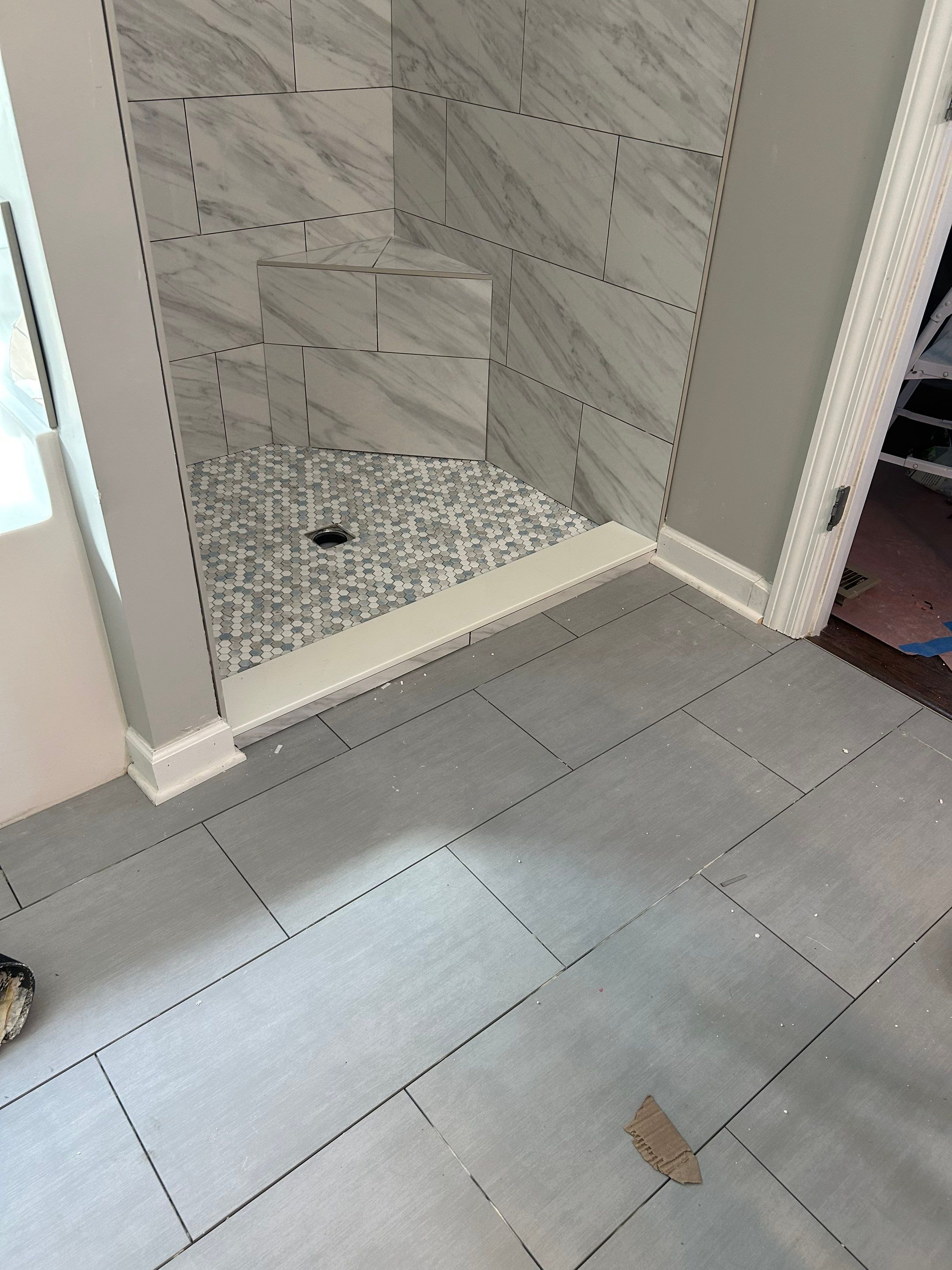 Tile shower remodel and heated floors by Footprints Floors of Nashville