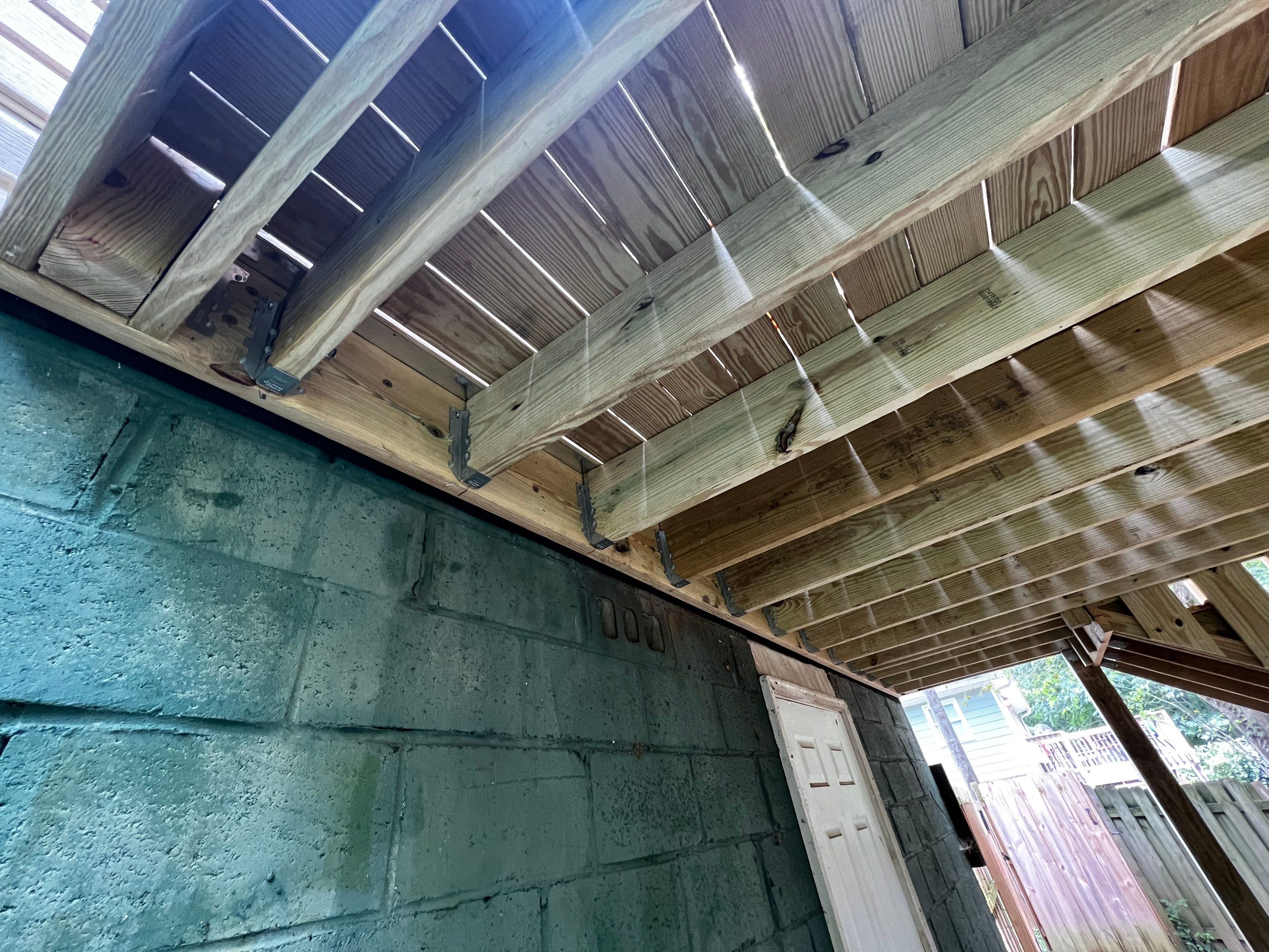 Elevated Pressure-Treated Wood Deck and Staircase Replacement in Atlanta by Swift Home Renovations