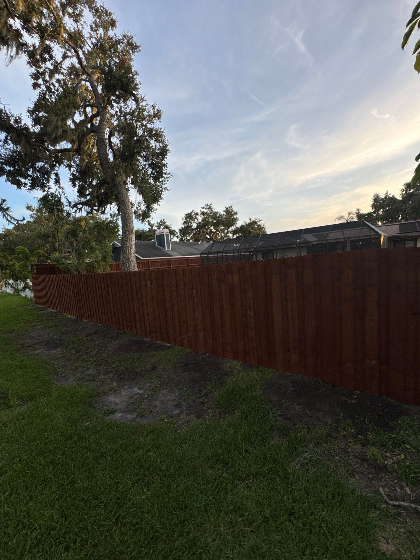 Wood Fence Installation using Pre-stained Pine Board On Board by Asap fence and gates, LLC
