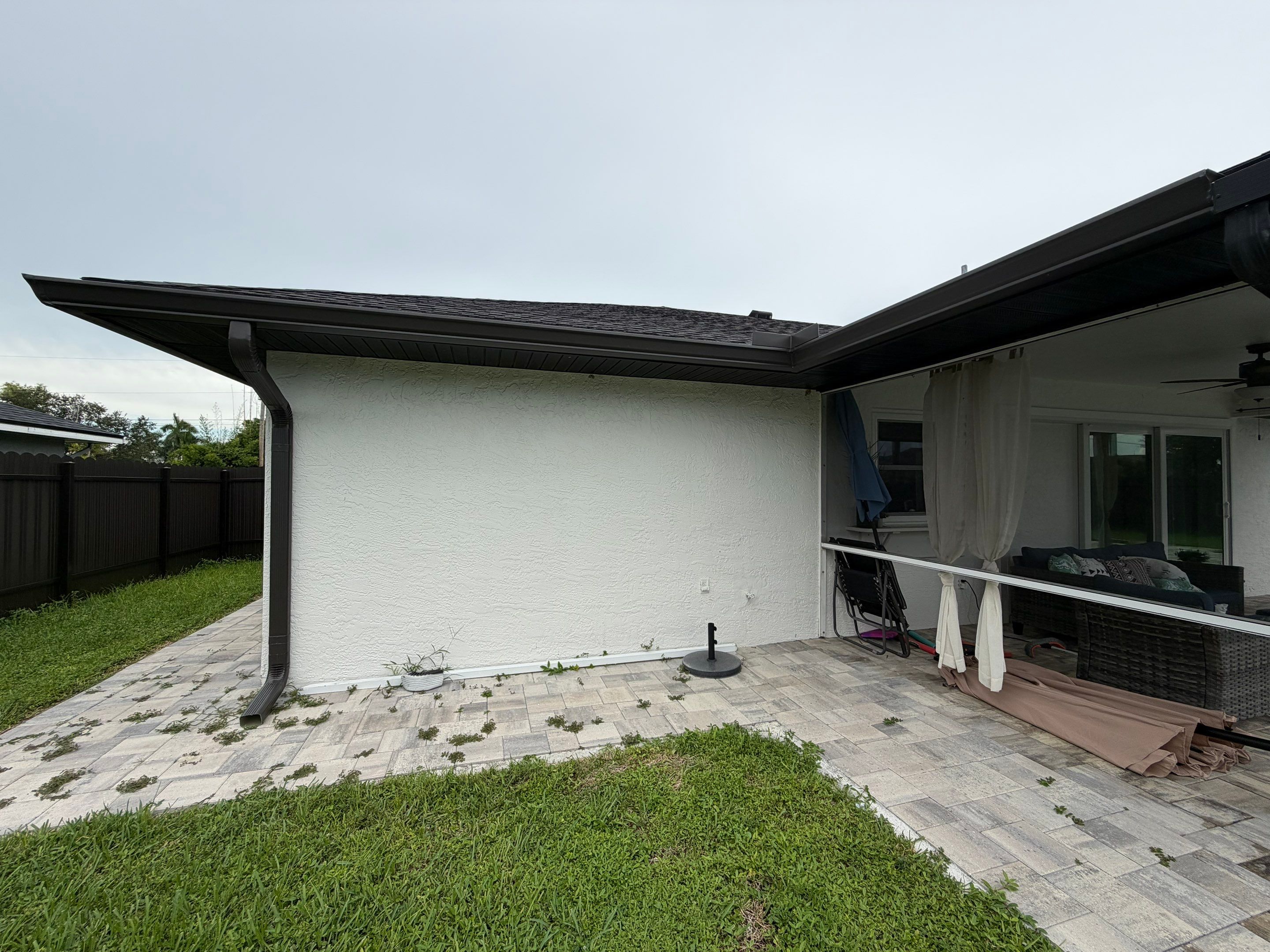 Black Seamless Gutters for a Modern Look in Cape Coral FL by Gutter Professors