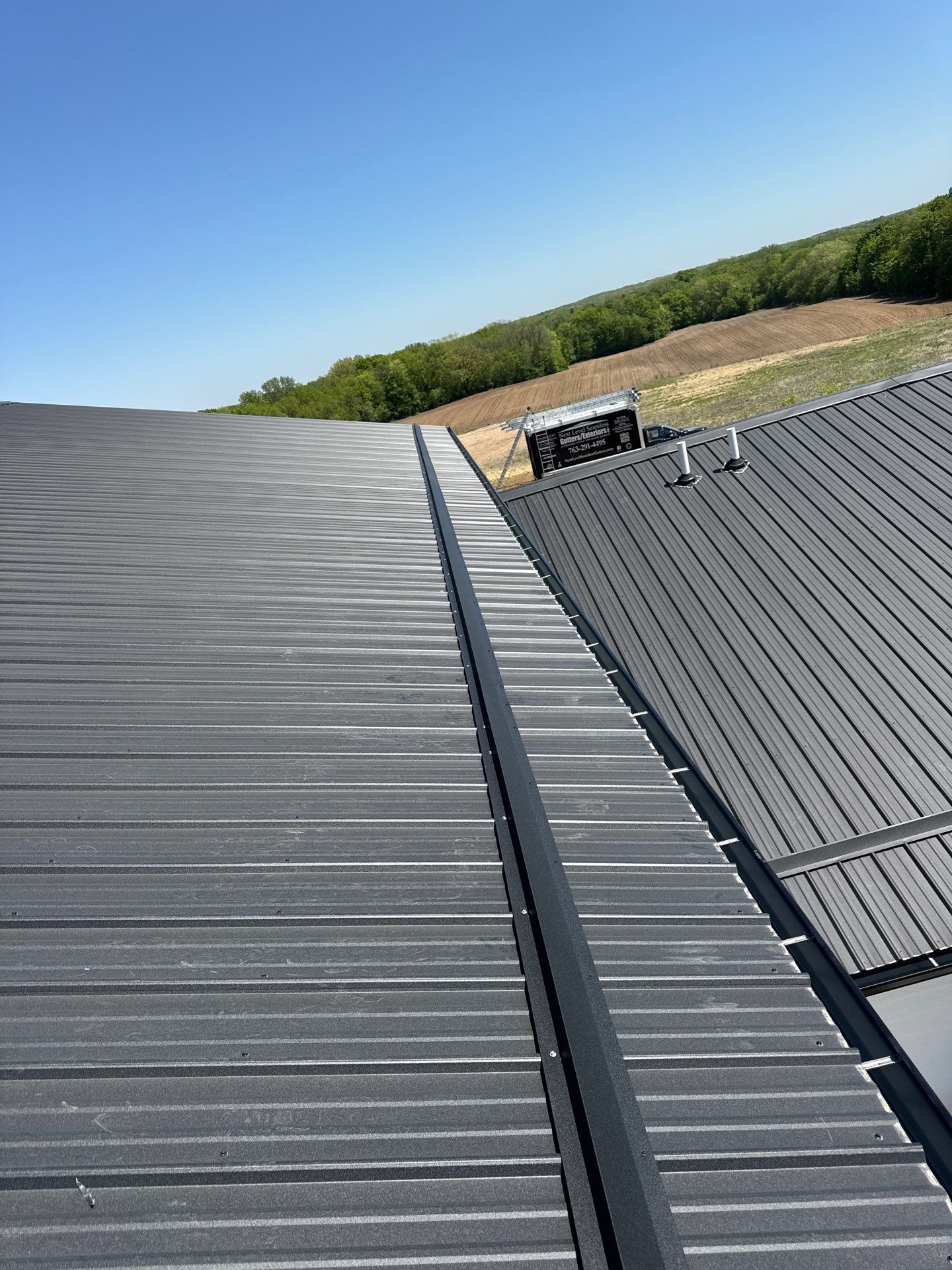 Black Gutter Installation + Snow Guards on Shouse by Next Level Seamless Gutters / Exteriors Inc.
