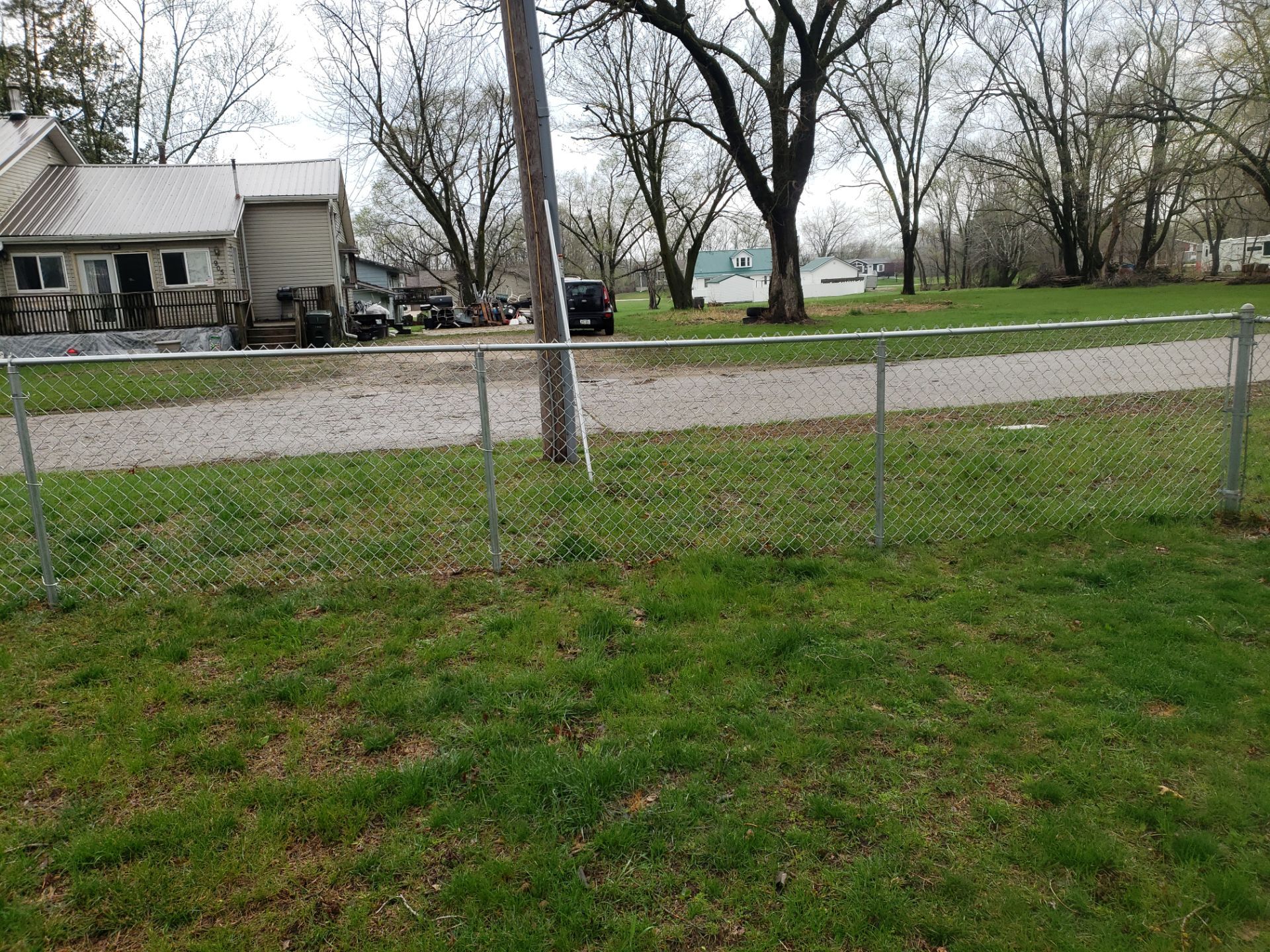 Galvanized Chain Link and Horizontal Wood Privacy Fencing in Waterloo by Perfect Picket Fence and Stain